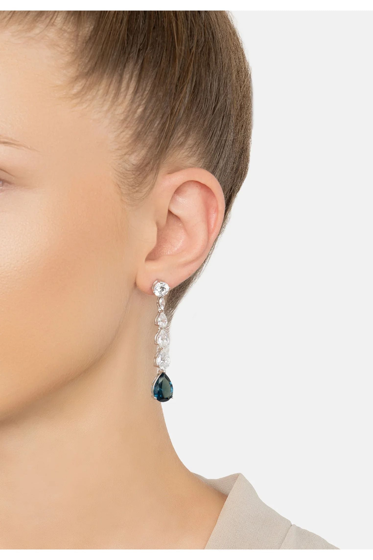 The earring worn by a model.