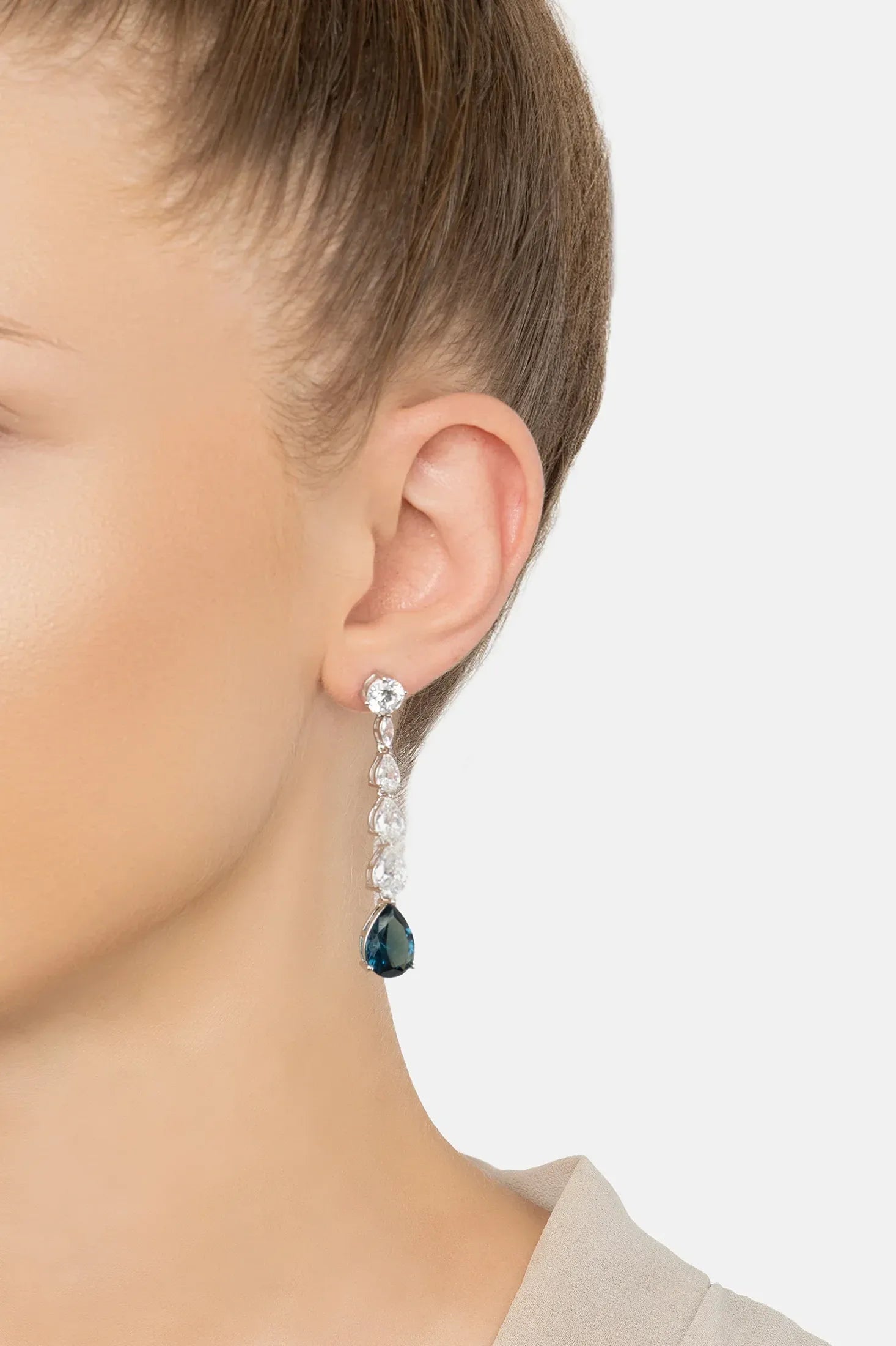 The earring worn by a model.