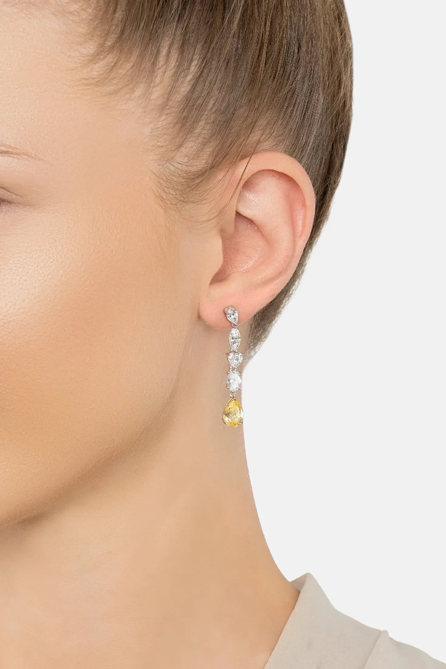 The earring worn by a model.