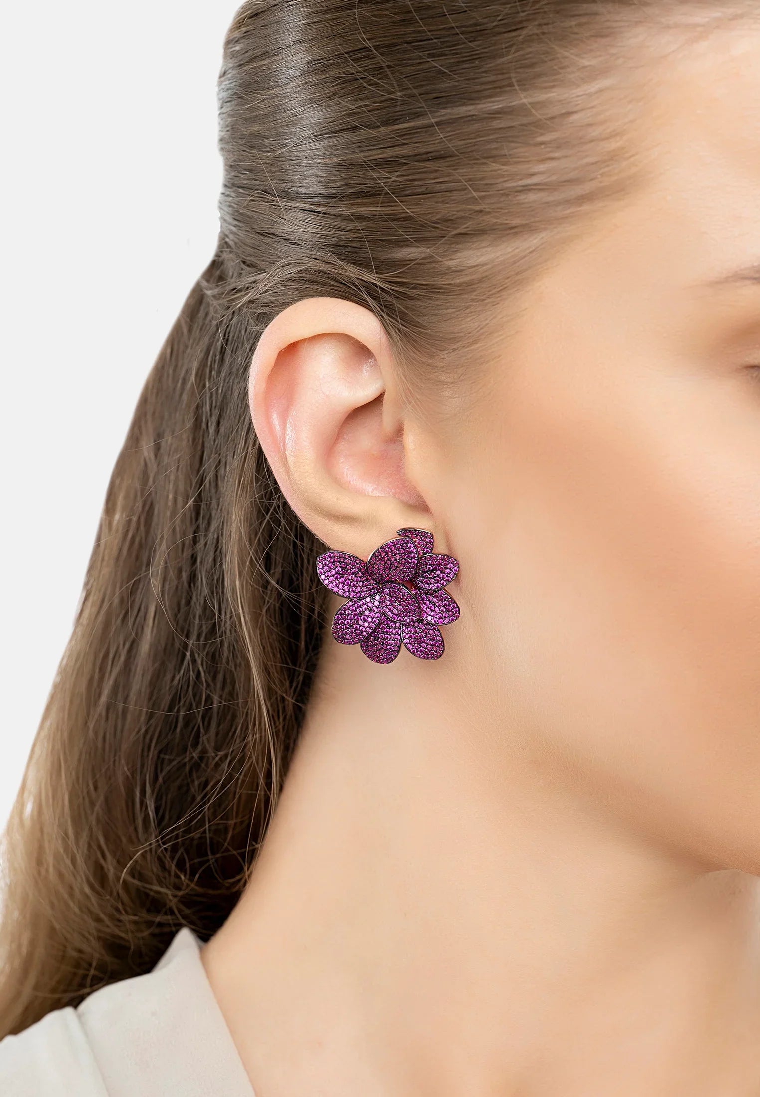 The earring worn by a model.