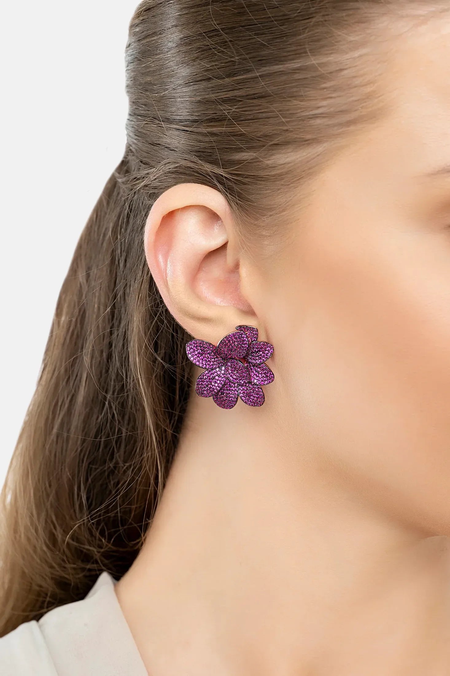 The earring worn by a model.