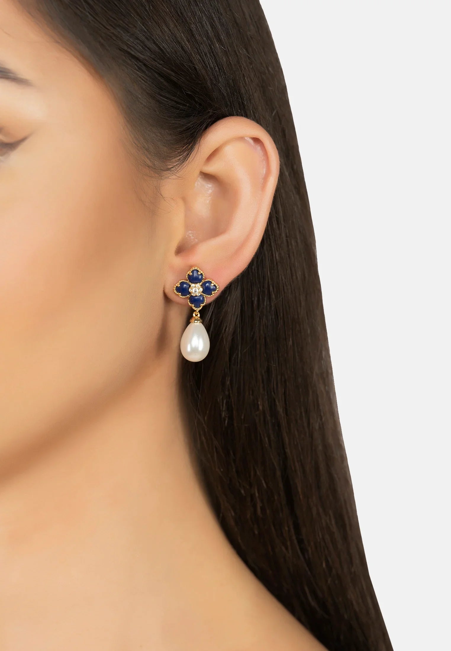 The earring worn by a model.