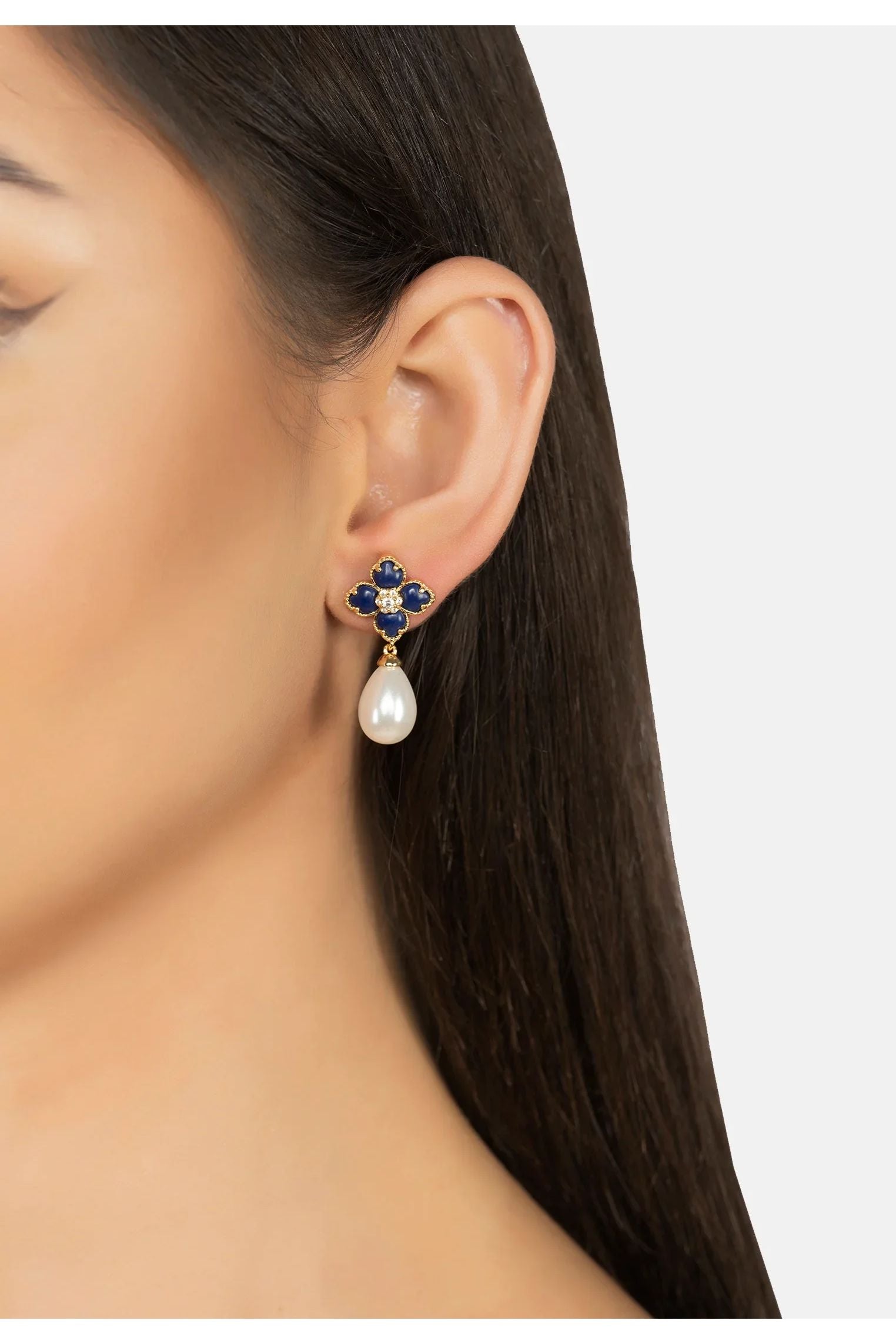 The earring worn by a model.