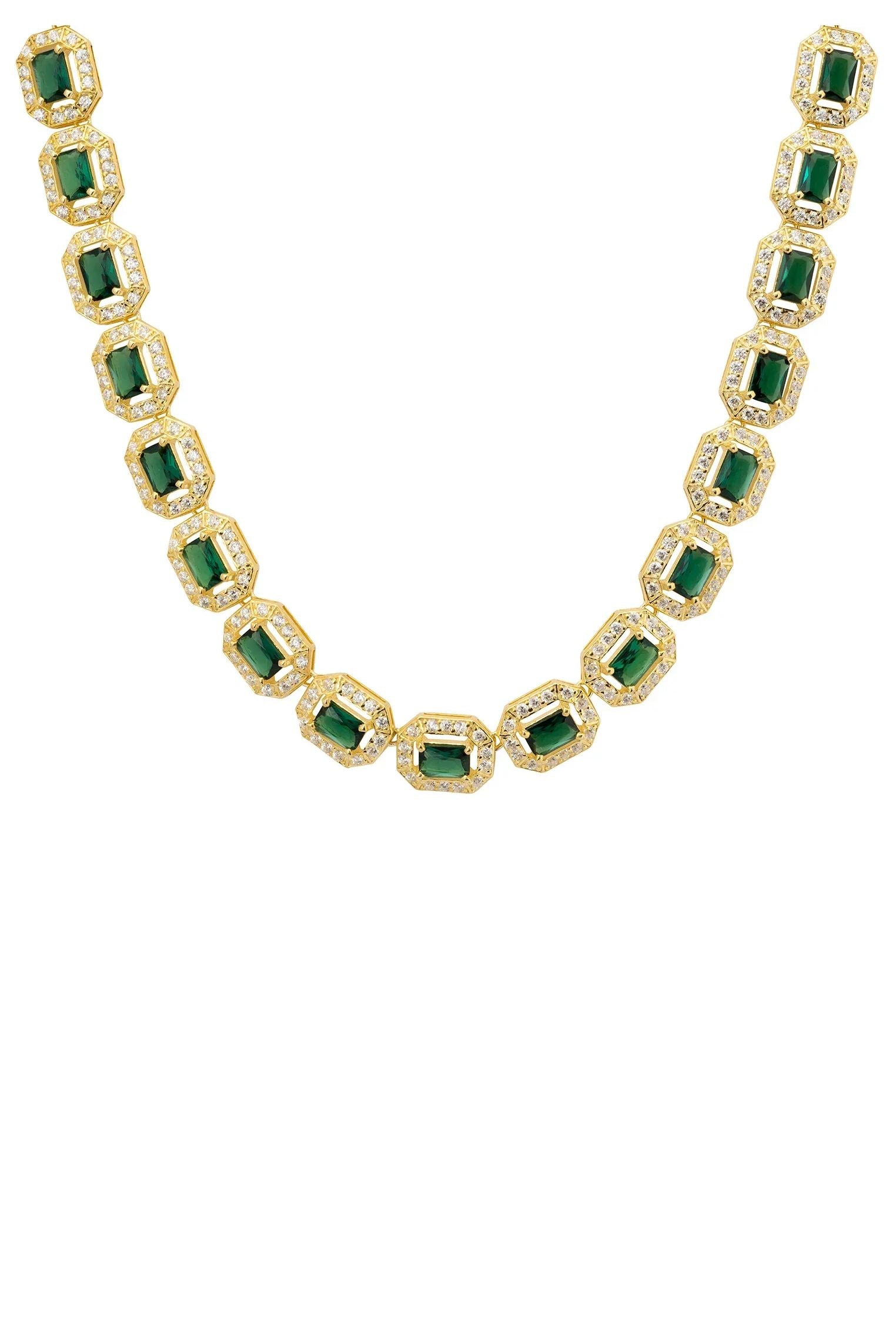 Close-up of the gold and diamond halo emeralds.