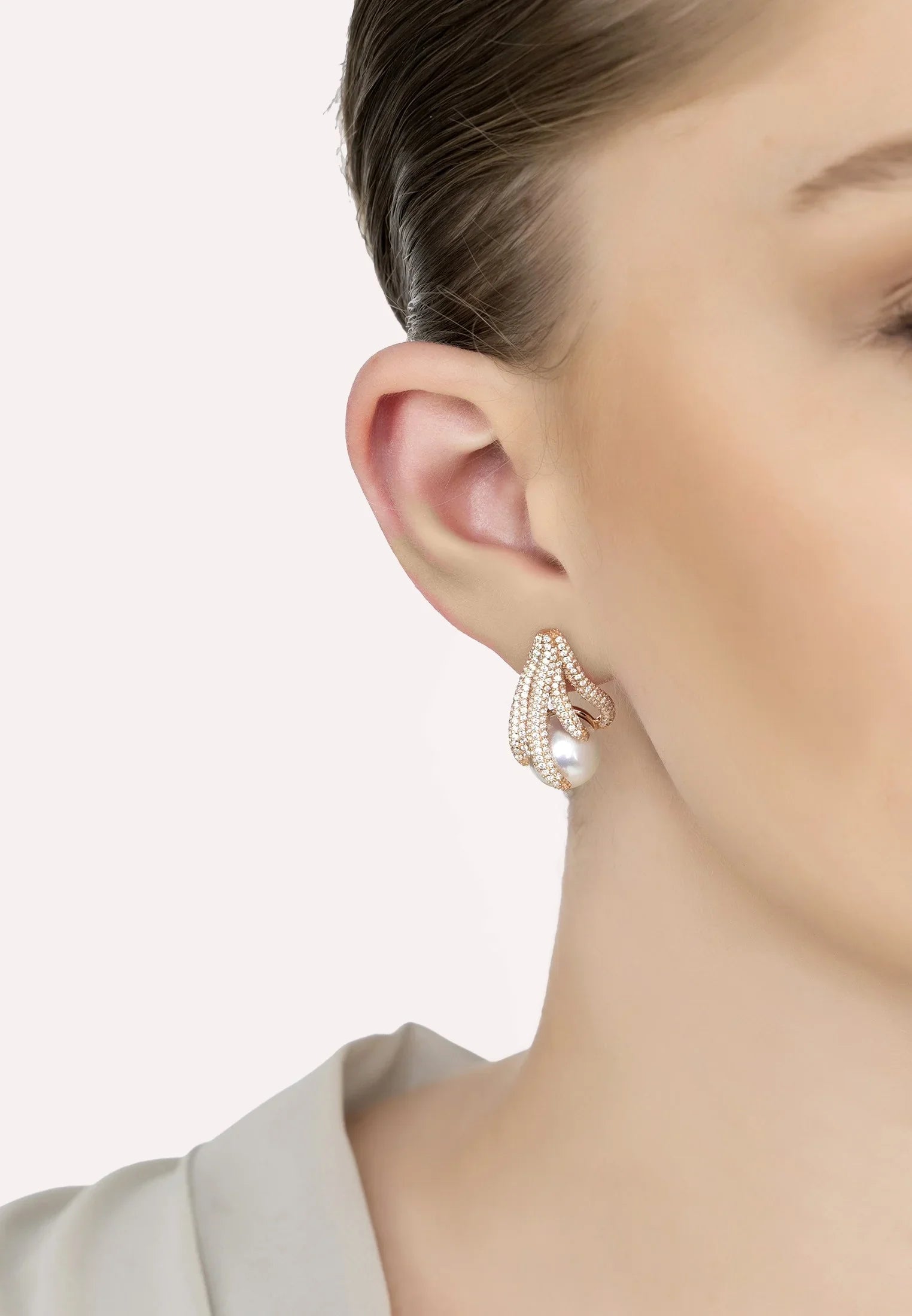The earring worn by a model.