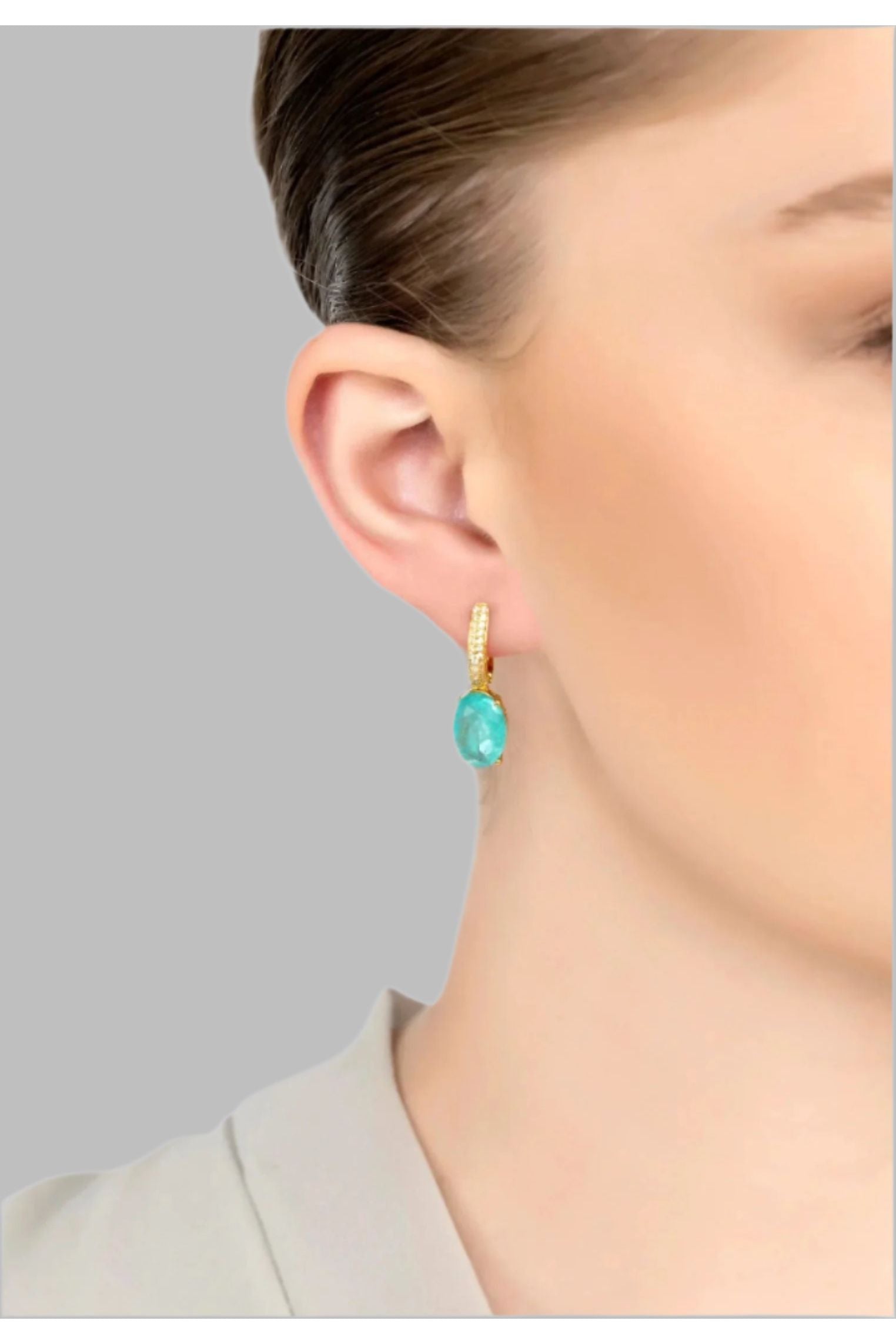 The earring worn by a model.