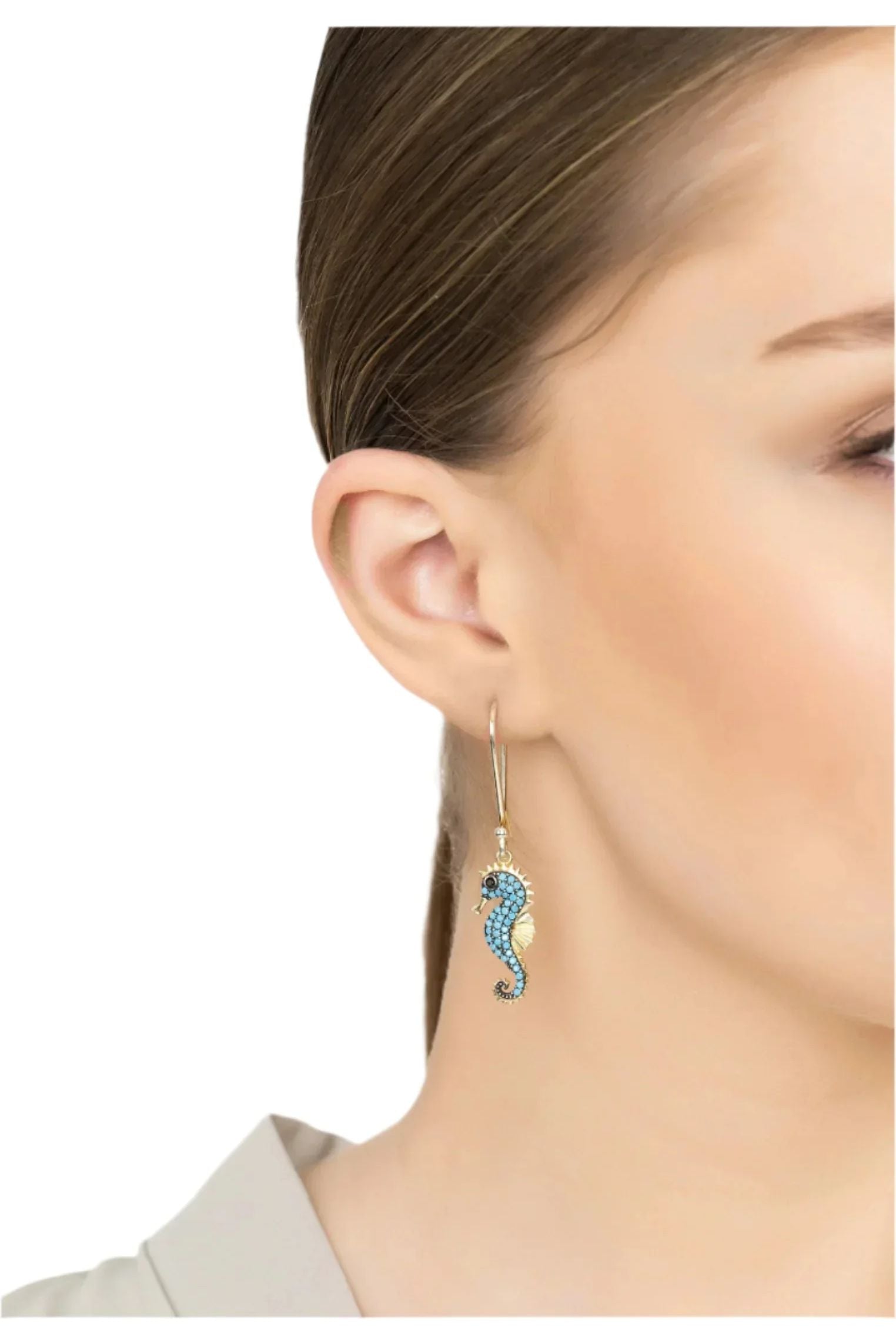 The earring worn by a model.