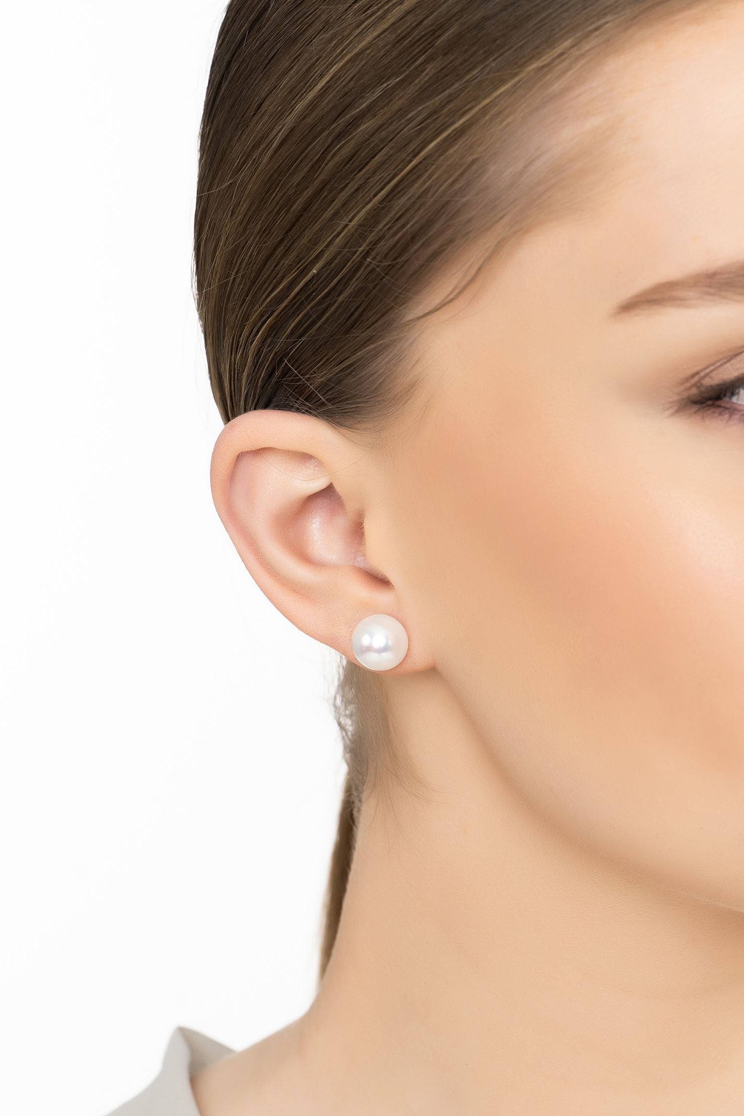 Angled view of Solid 14K Gold 11mm Classic Natural Pearl Stud Earrings, showing pearl detailing, gold finish and the jewellery profile.