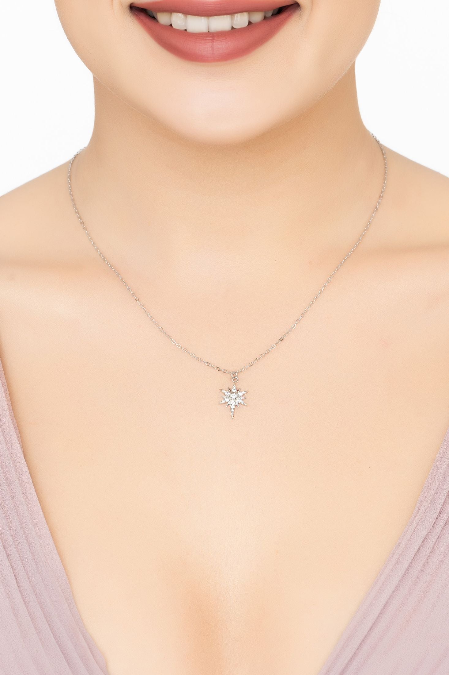 Angled view of Sunbeam Symphony Pendant Necklace Silver, showing sun design, silver finish and the jewellery profile.