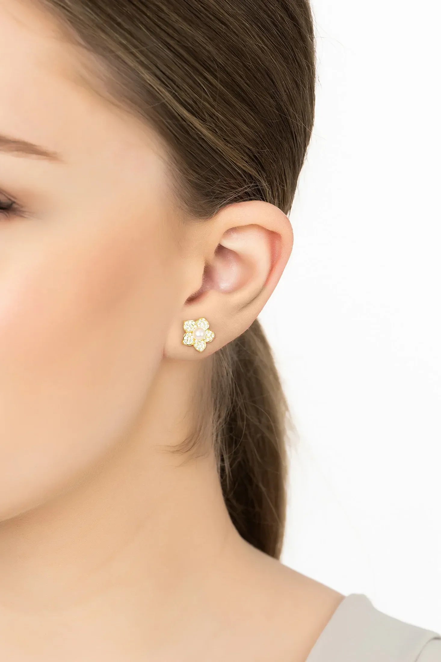 Angled view of Forget Me Not Pearl Stud Earrings Gold, showing pearl detailing, gold finish and the jewellery profile.