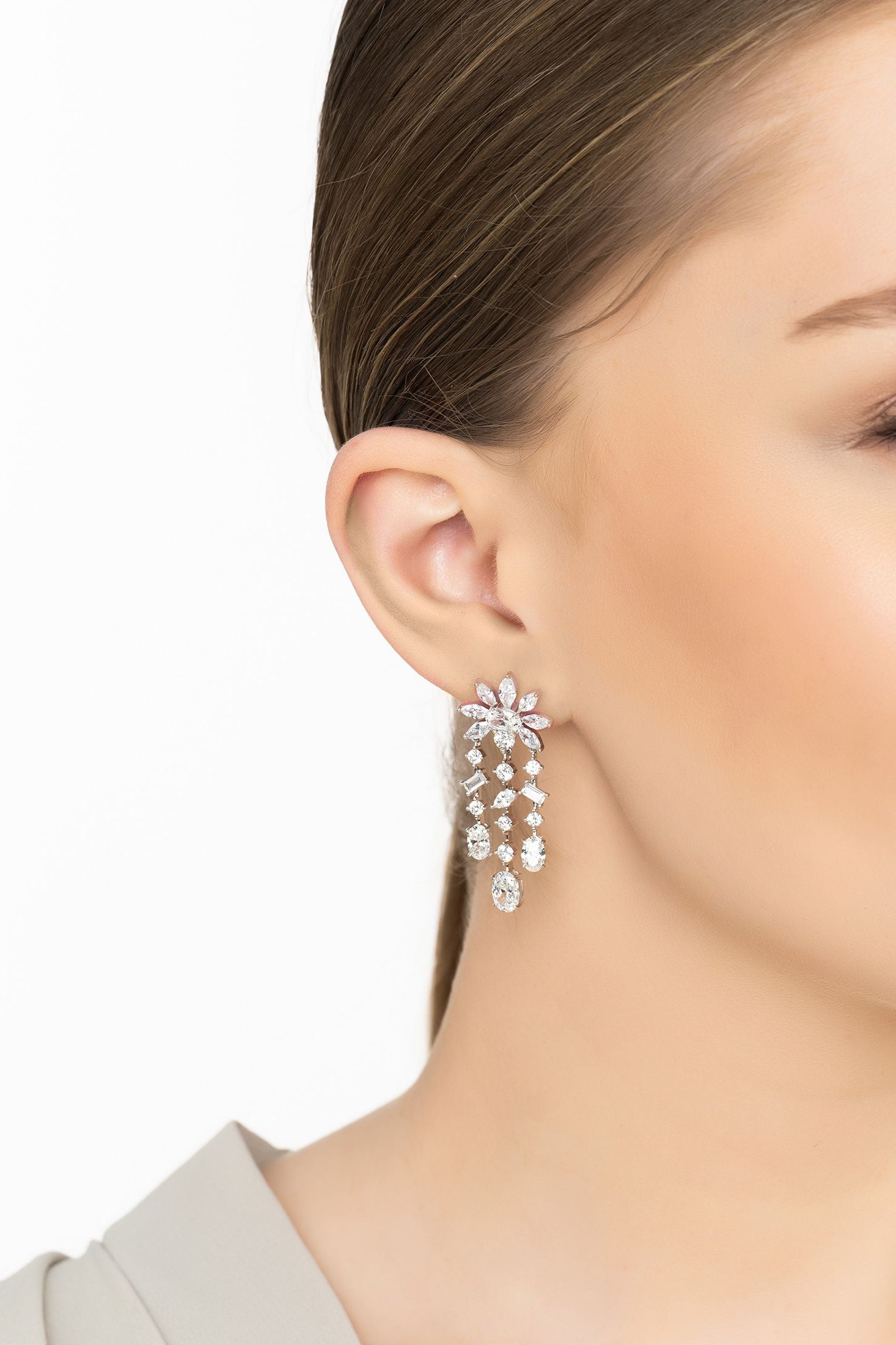 Angled view of Margarita Daisy Flower Moissanite Chandelier Earrings Silver, showing flower design, silver finish and the jewellery profile.