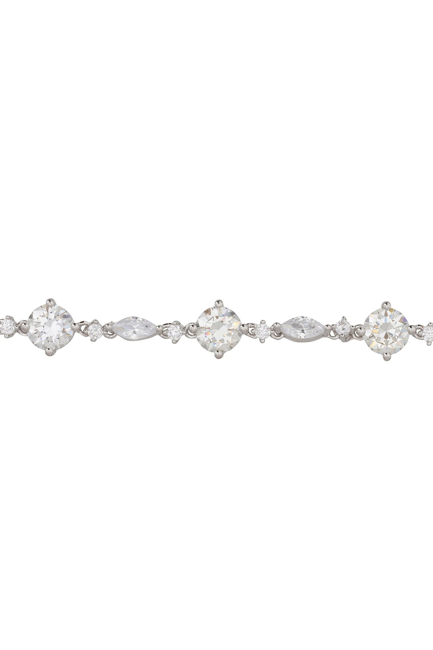 Angled view of Charlize Tennis Bracelet Moissanite Silver, showing silver finish and the jewellery profile.