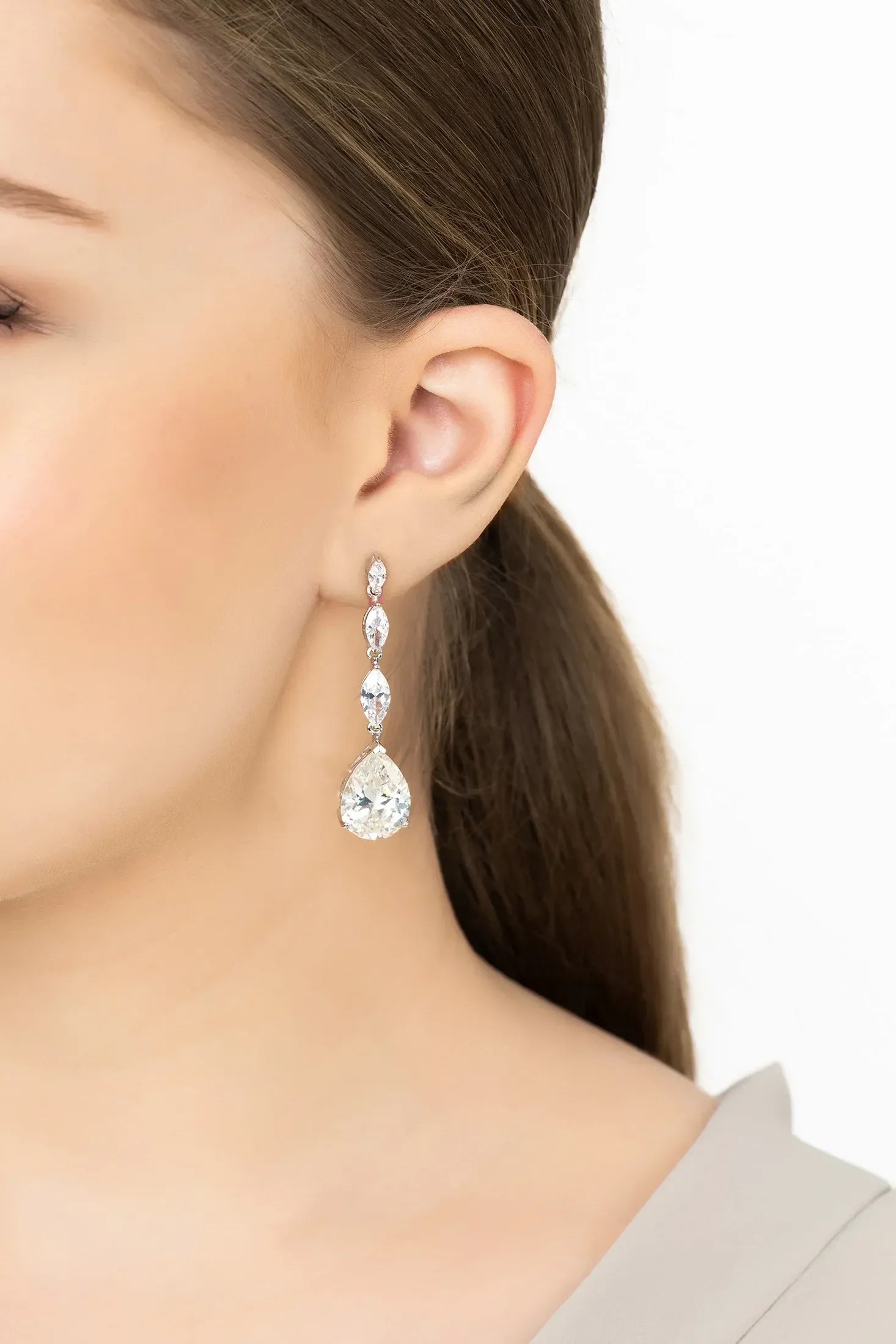 Angled view of Zara Teardrop Moissanite Gemstone Earrings Silver, showing silver finish and the jewellery profile.
