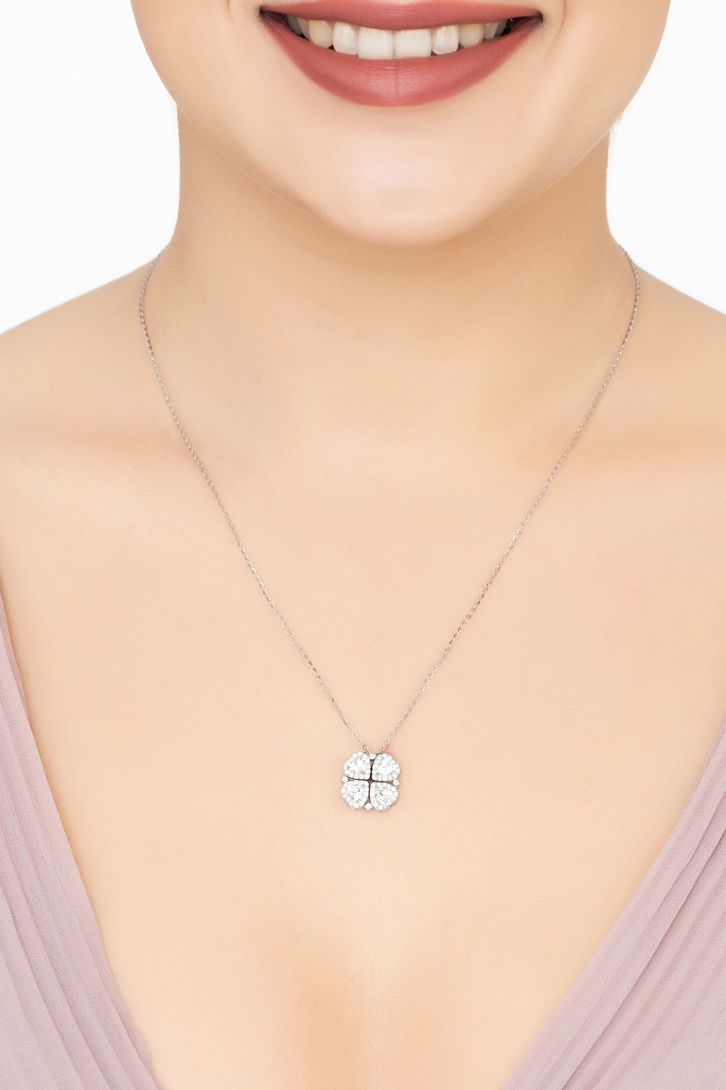 Angled view of Love And Luck Convertible Necklace Silver, showing silver finish and the jewellery profile.