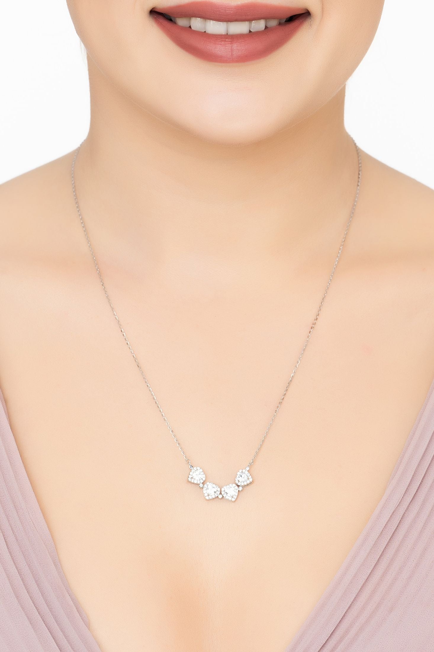 Angled view of Love And Luck Convertible Necklace Silver, showing silver finish and the jewellery profile.