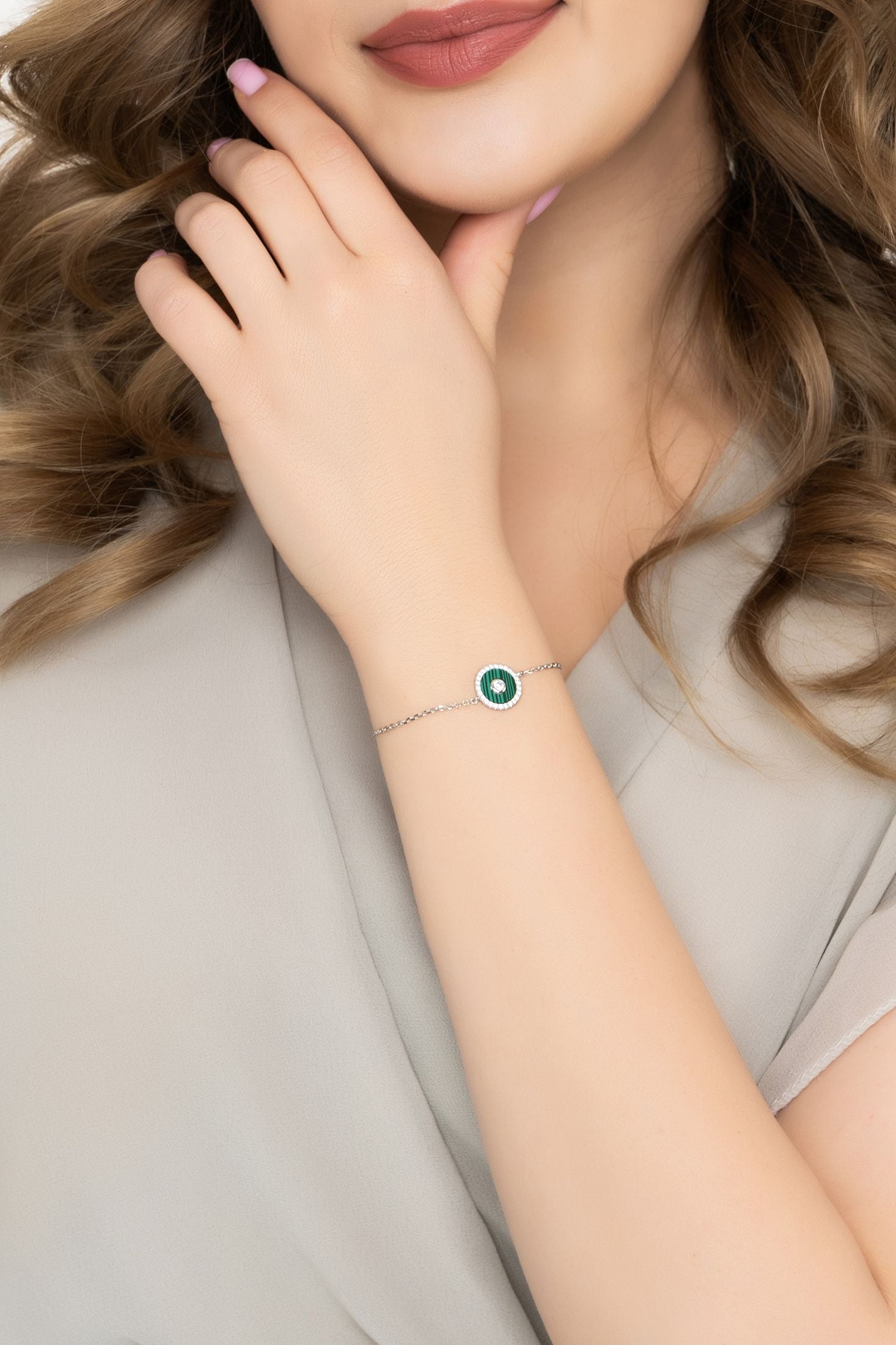 Angled view of Mystique Amulet Malachite Bracelet Silver, showing malachite detailing, silver finish and the jewellery profile.