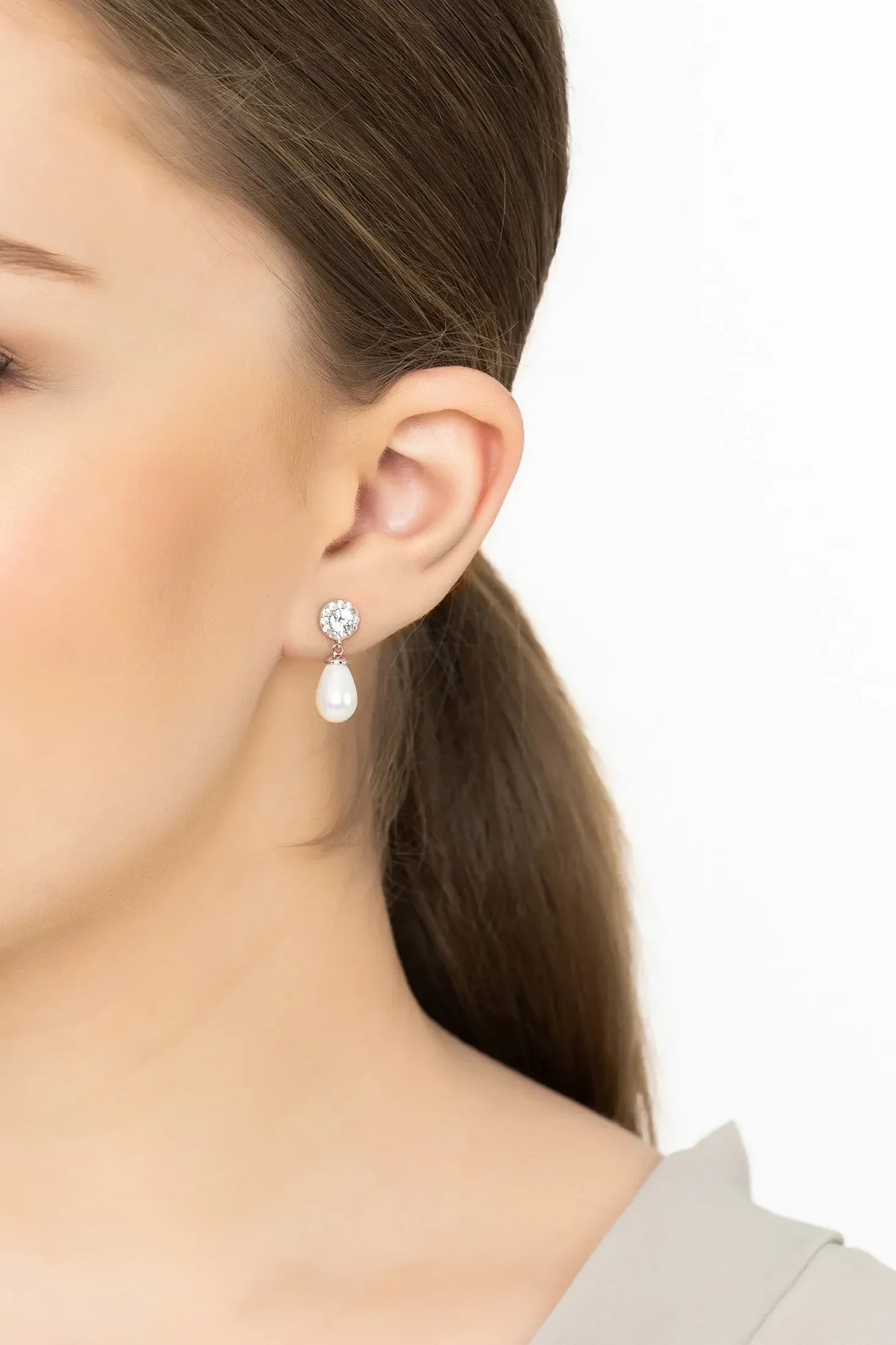Angled view of Timeless Pearl Teardrop Earrings Silver, showing pearl detailing, silver finish and the jewellery profile.