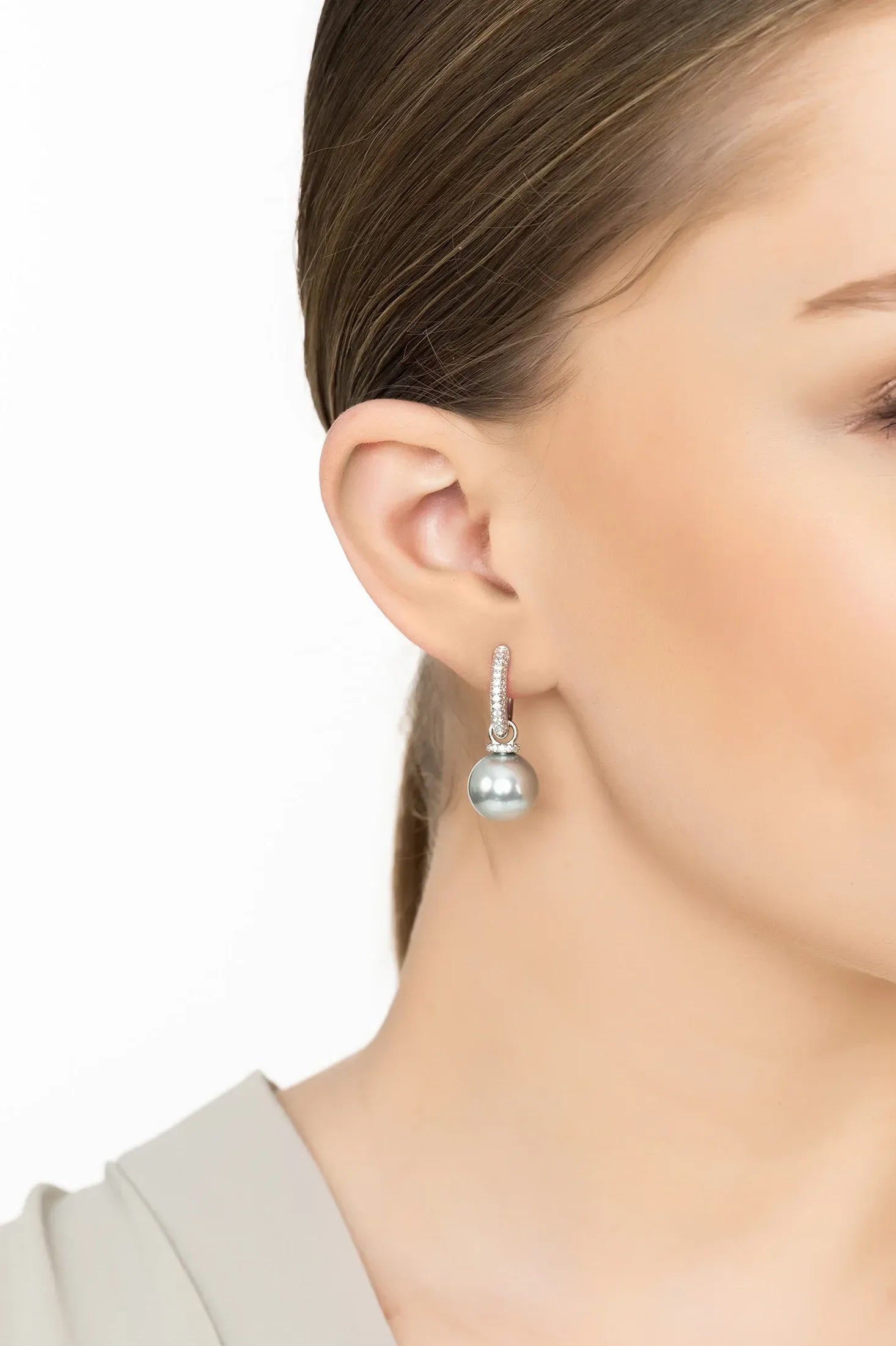 Angled view of Twilight Whisper Hoop Earrings Grey Pearl Silver, showing pearl detailing, silver finish and the jewellery profile.