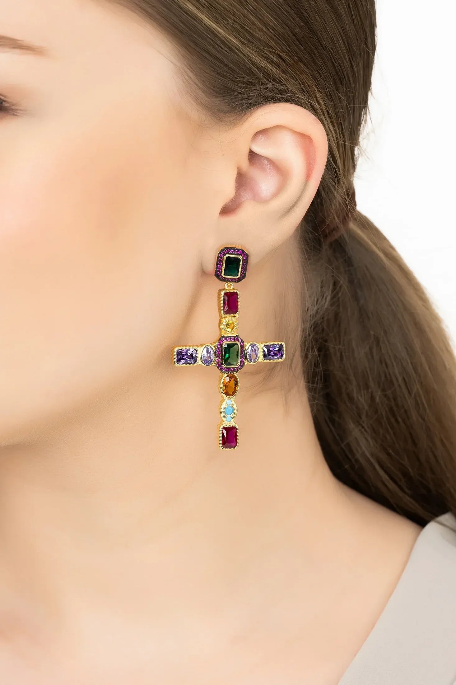 Angled view of Maria Extra Large Gemstone Fashion Earrings Gold (Cross), showing cross design, gold finish and the jewellery profile.