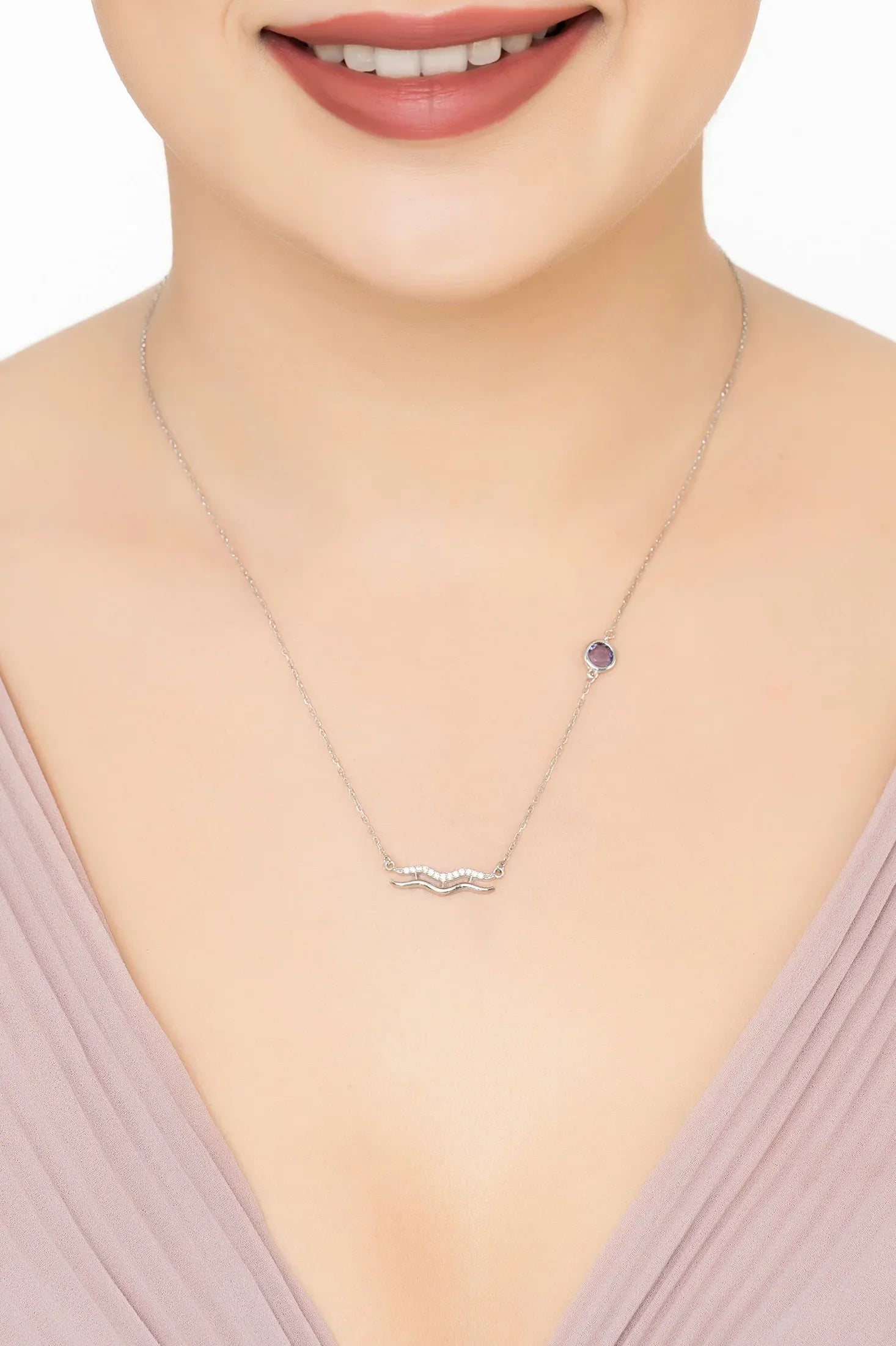 Angled view of Zodiac Birthstone Aquarius Necklace Amethyst Silver, showing zodiac design, amethyst detailing, silver finish and the jewellery profile.