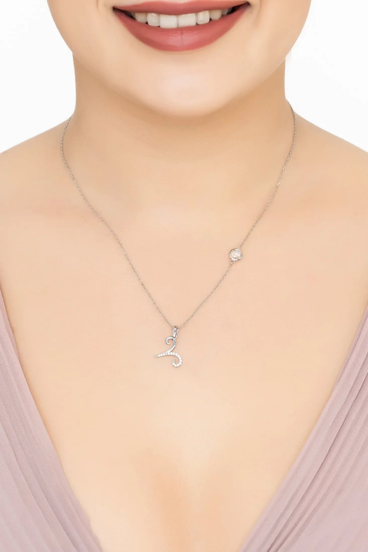 Angled view of Zodiac Birthstone Aries Necklace Cubic Zirconia Silver, showing zodiac design, cubic zirconia and zirconia detailing, silver finish and the jewellery profile.