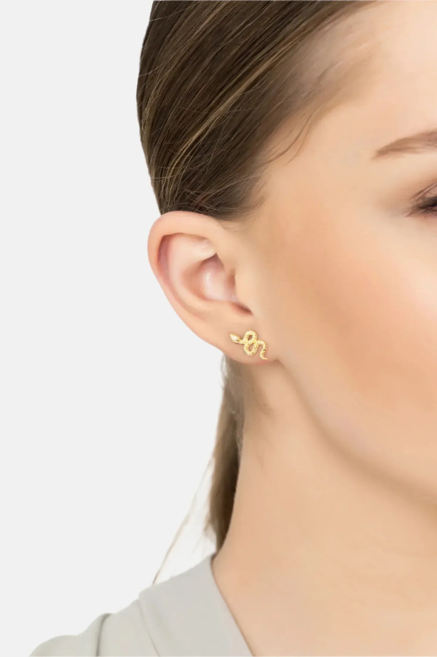 Angled view of Coiled Cobra Snake Stud Earrings Gold, showing snake design, gold finish and the jewellery profile.