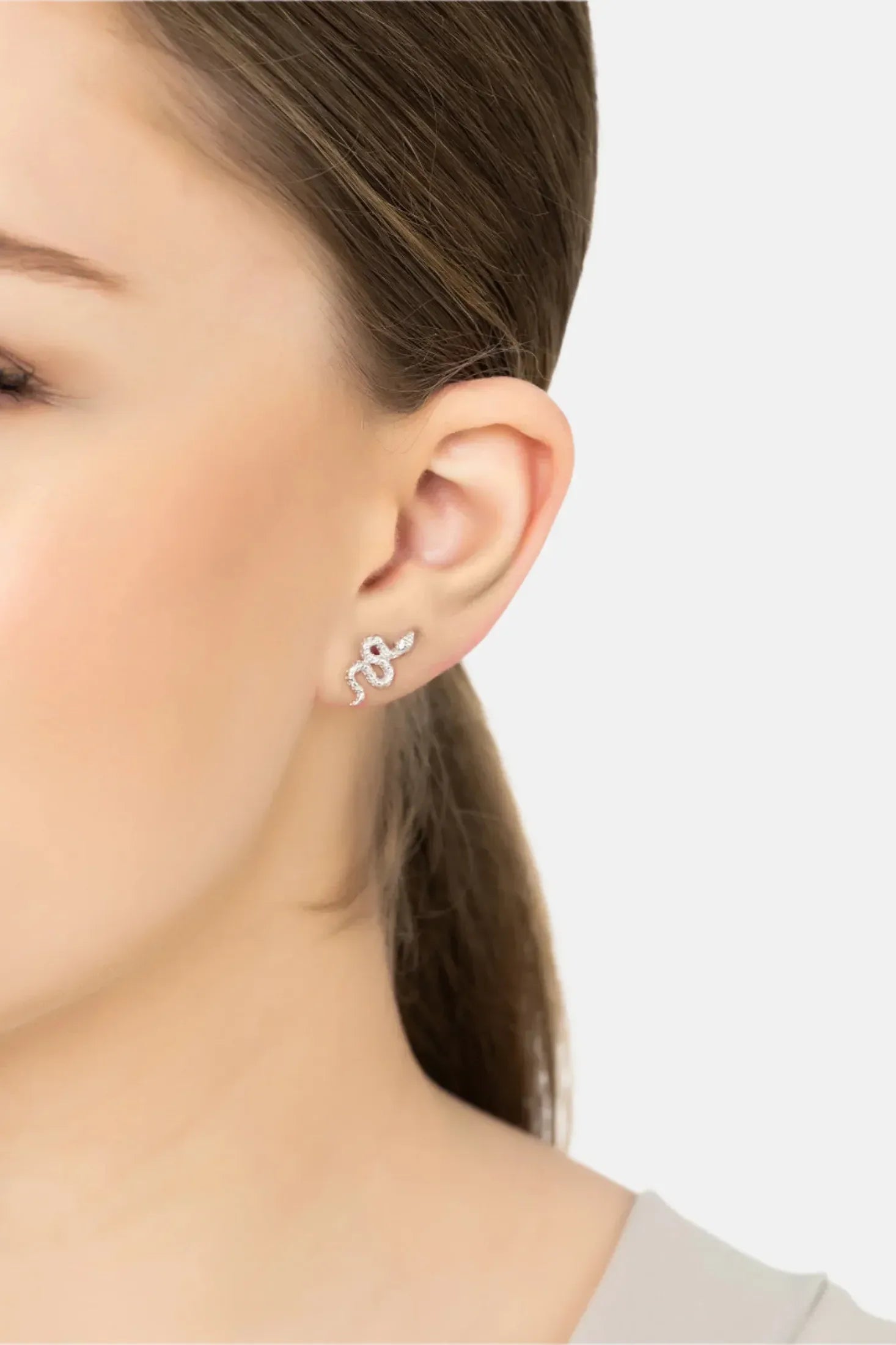 Angled view of Coiled Cobra Snake Stud Earrings Silver, showing snake design, silver finish and the jewellery profile.
