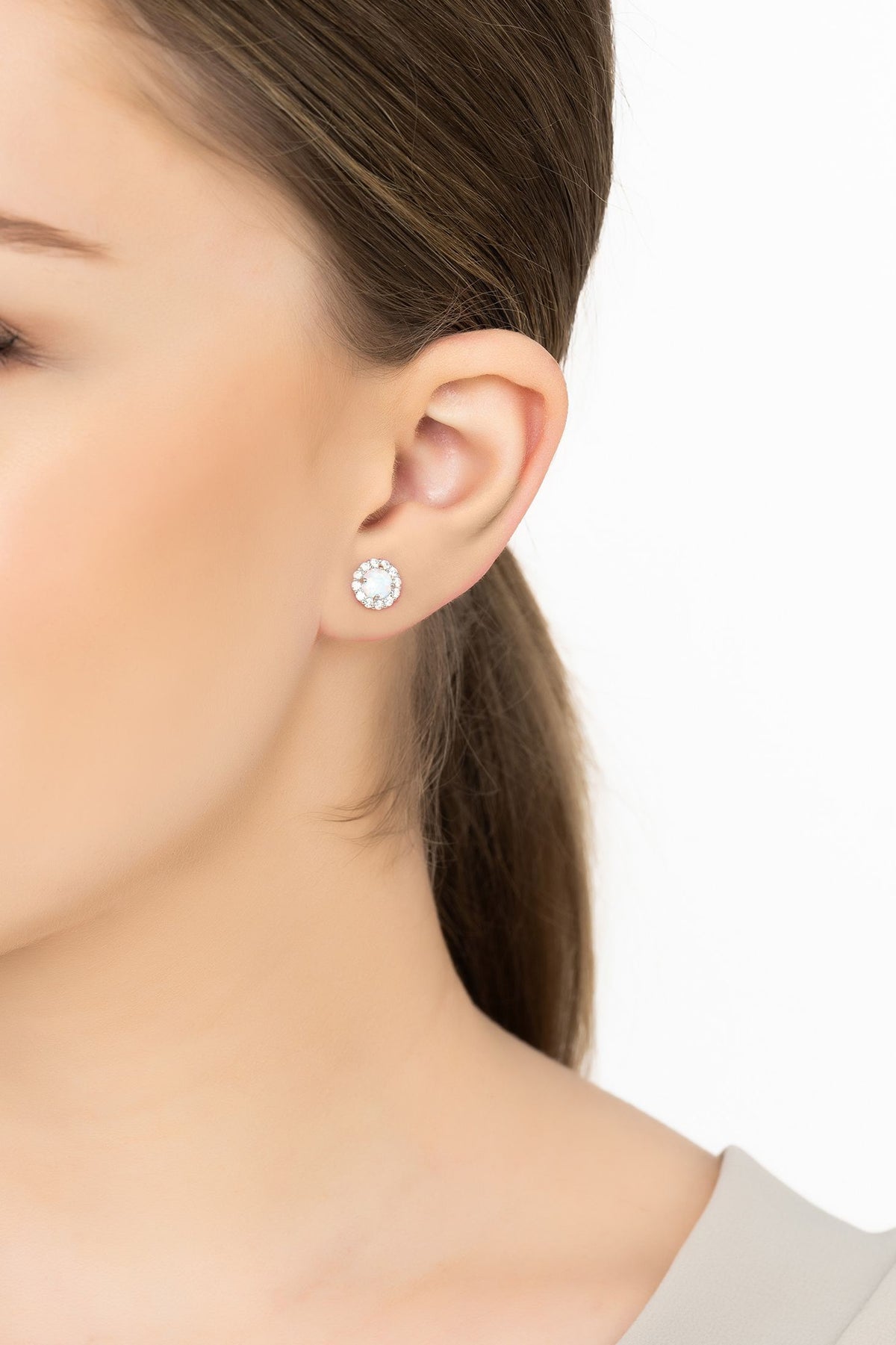 Angled view of Crown Opal Stud Earrings Silver, showing silver finish and the jewellery profile.
