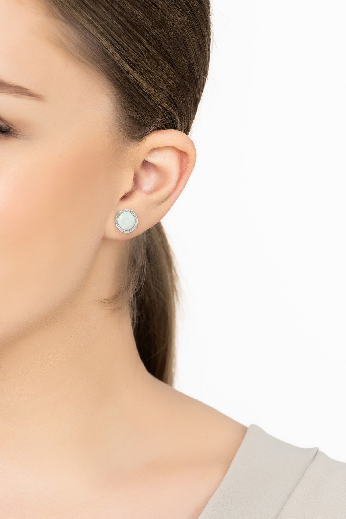 Angled view of Large Sparkling Halo Opal Stud Earrings Silver, showing silver finish and the jewellery profile.