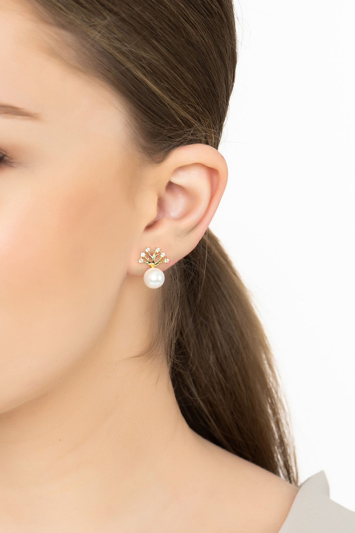 Angled view of Willow And Pearl Earrings Gold, showing pearl detailing, gold finish and the jewellery profile.