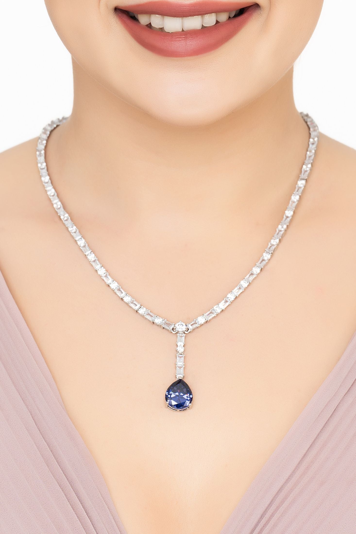 Angled view of Claudette Statement Necklace Silver Tanzanite, showing tanzanite detailing, silver finish and the jewellery profile.