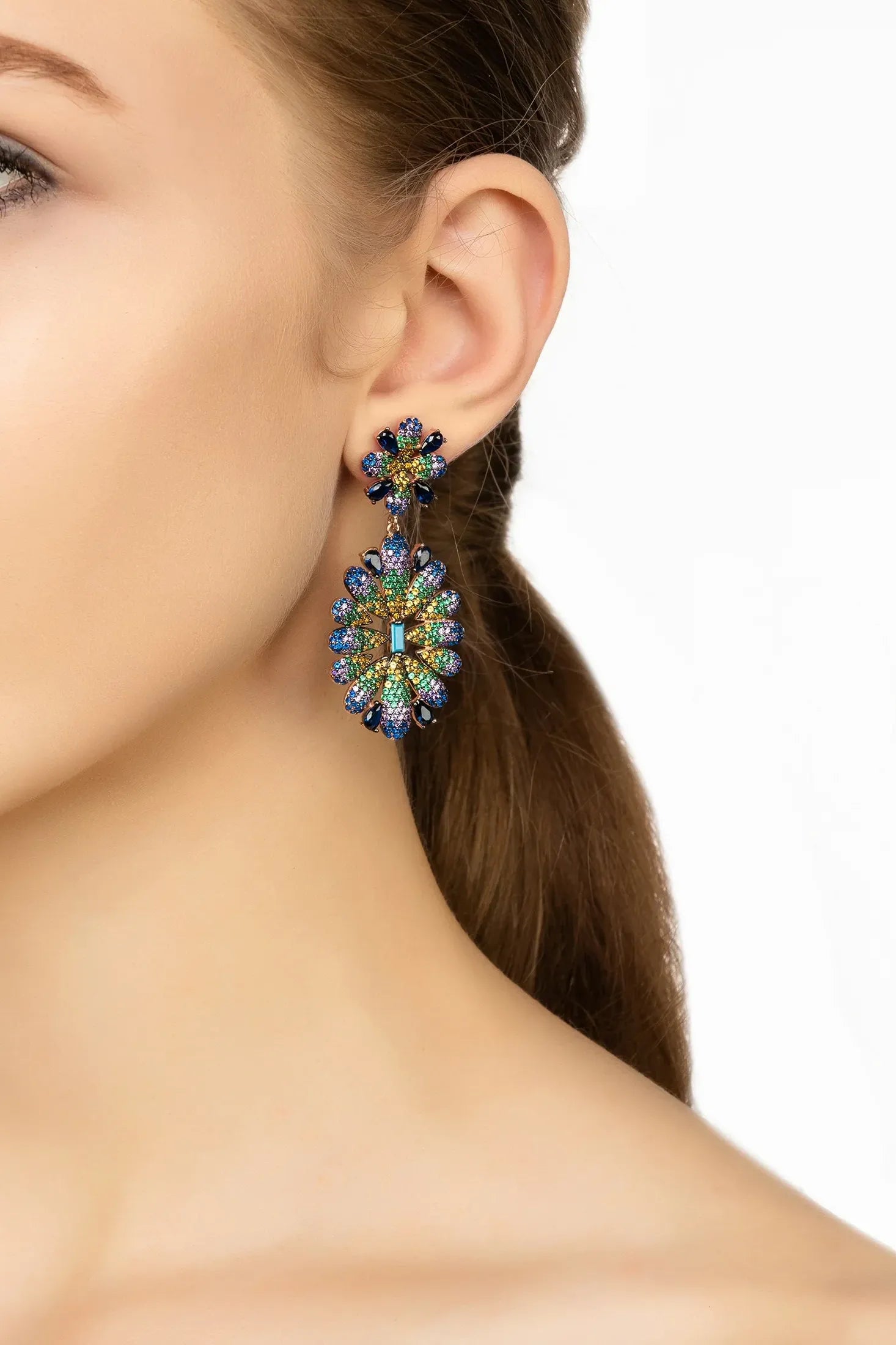 Angled view of Babylon Multicoloured Flower Drop Earrings Gold, showing flower design, gold finish and the jewellery profile.