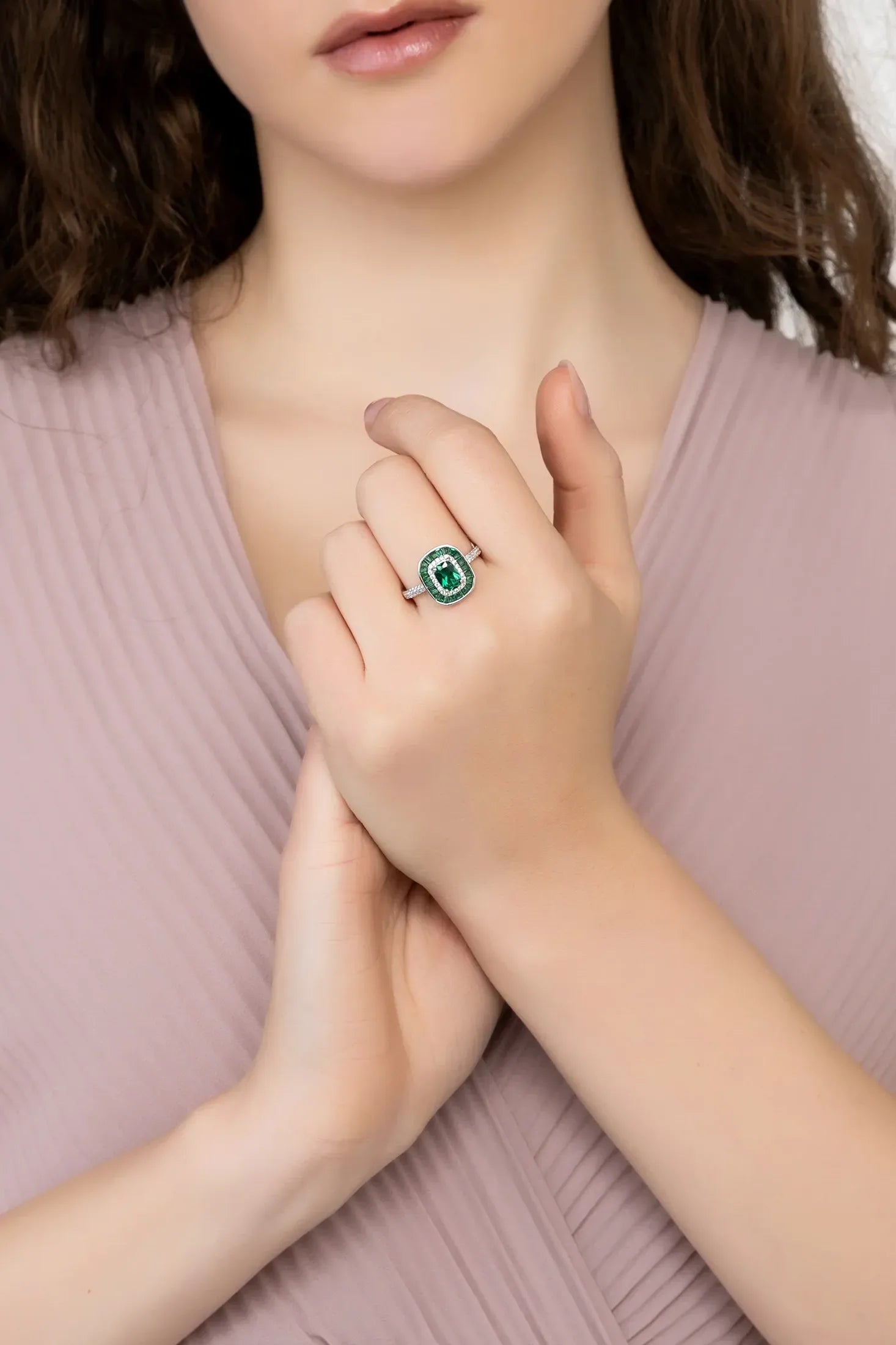 Angled view of Great Gatsby Cocktail Ring Emerald Silver, showing emerald detailing, silver finish and the jewellery profile.