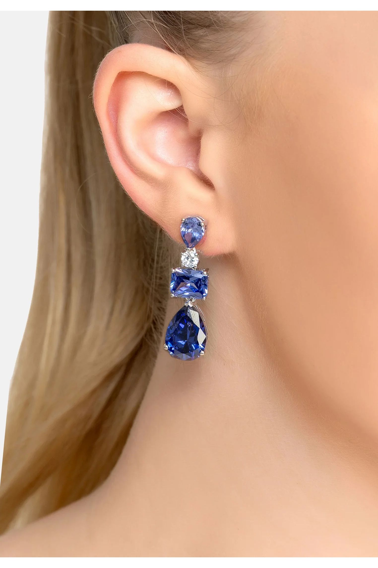 The earring worn by a model.