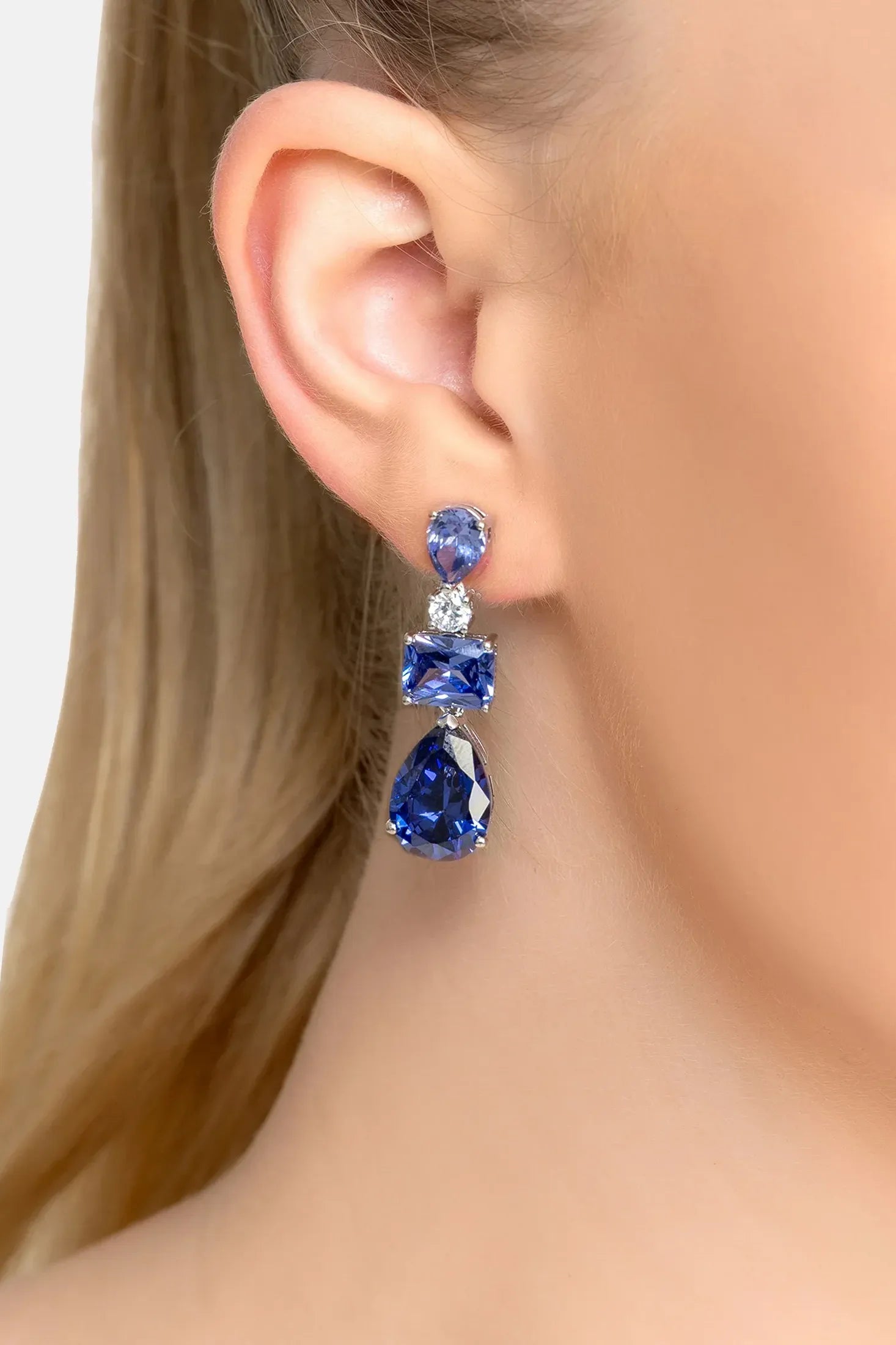 The earring worn by a model.
