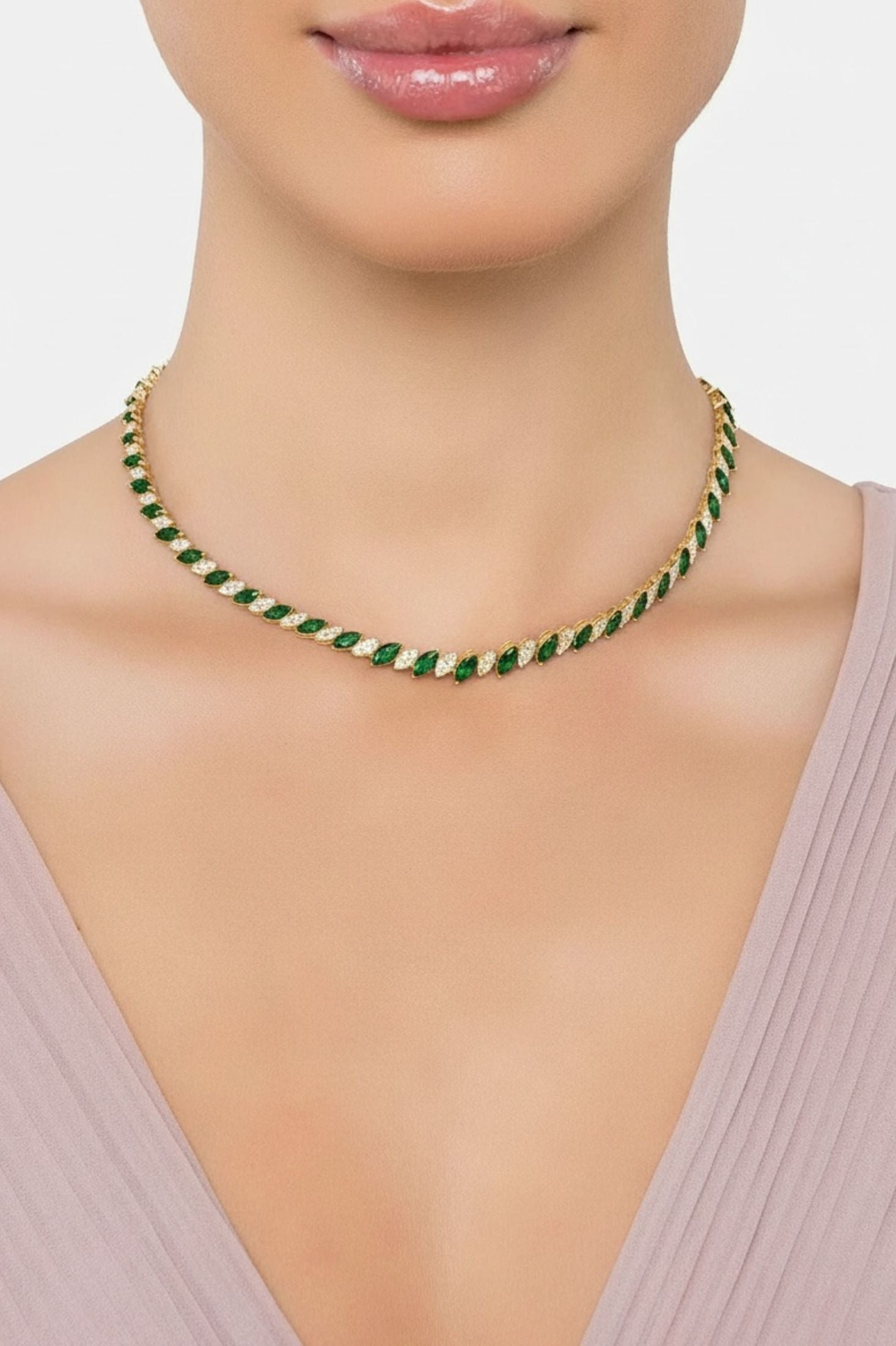 Gold and green necklace worn by a model.
