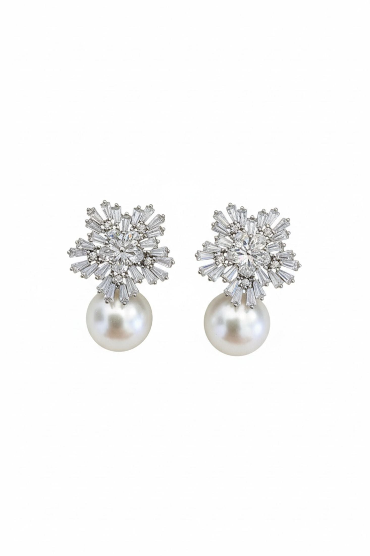Rhodium plated starburst flower and pearl earrings with cubic zirconia.