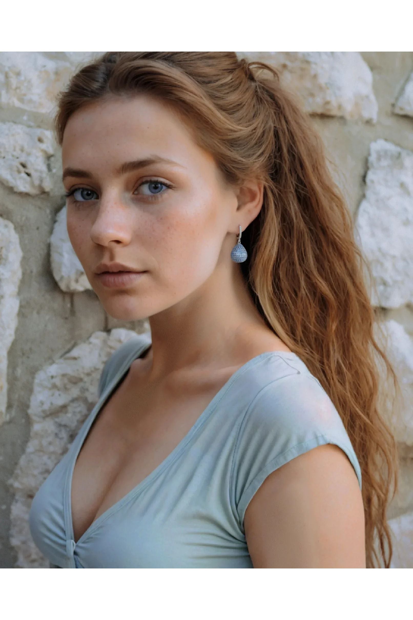 The earring worn by a model.
