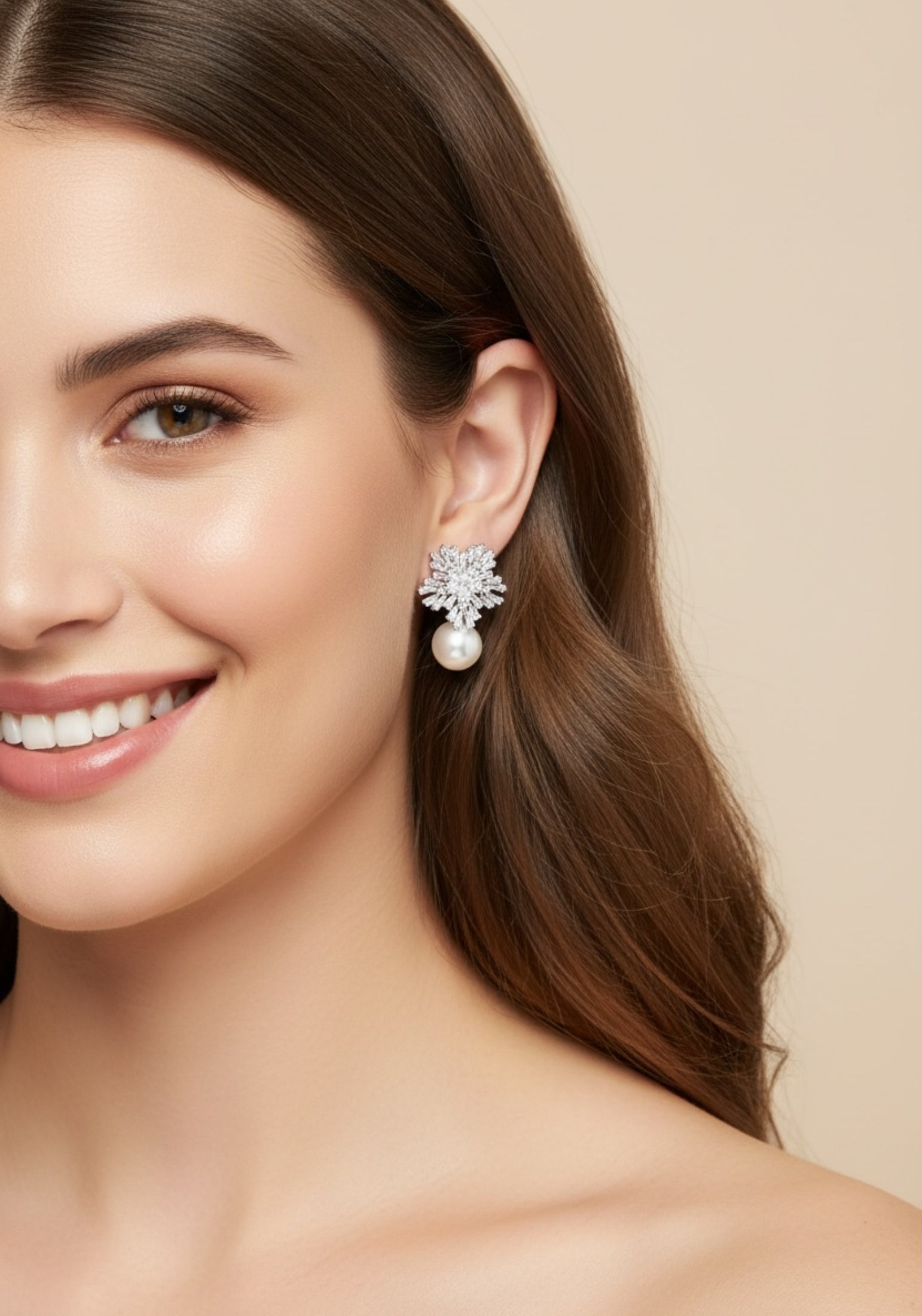 Silver star shaped earrings with a pearl worn by a model.