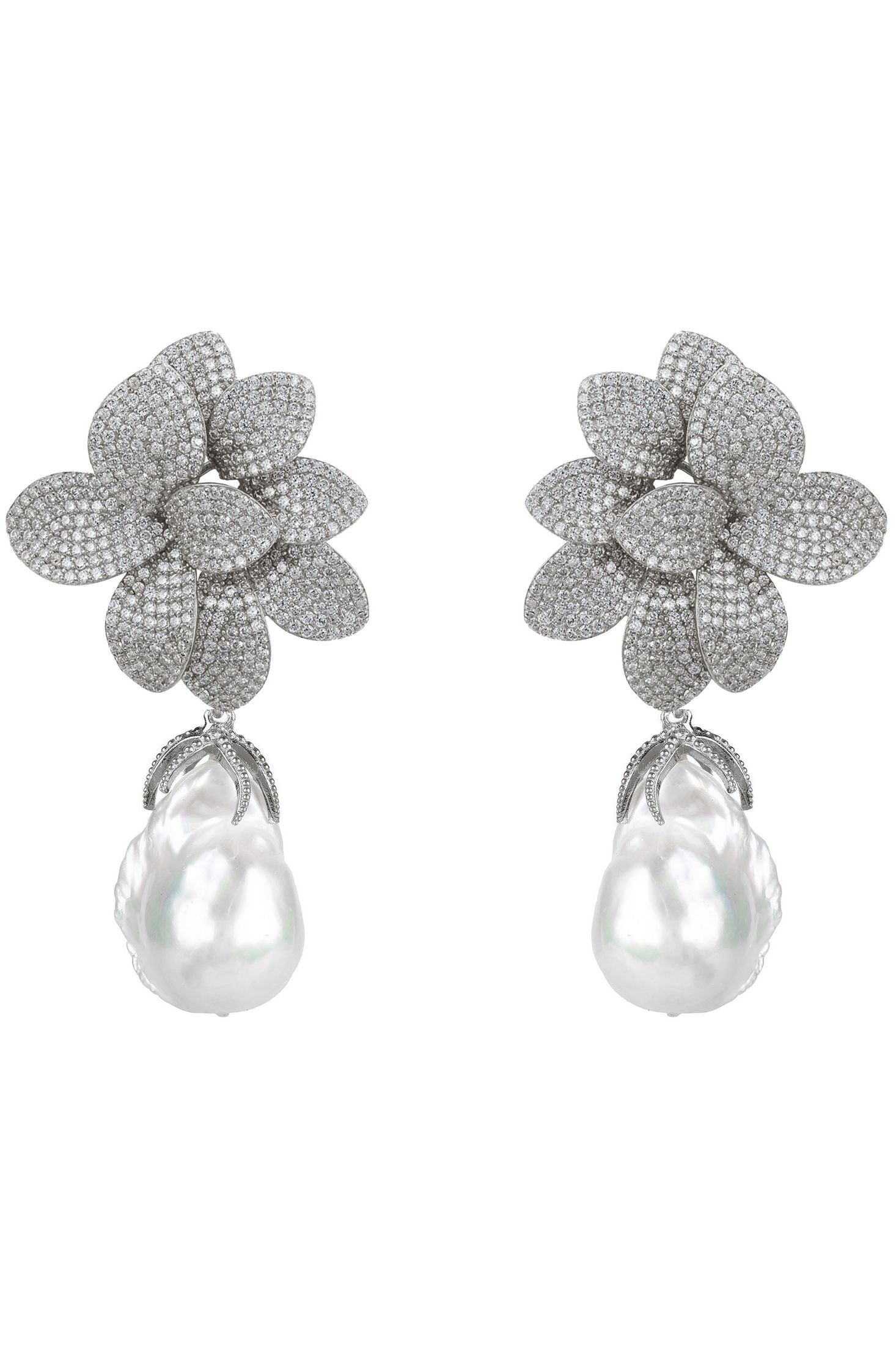 Pair of floral earrings with pearl drops on a white background