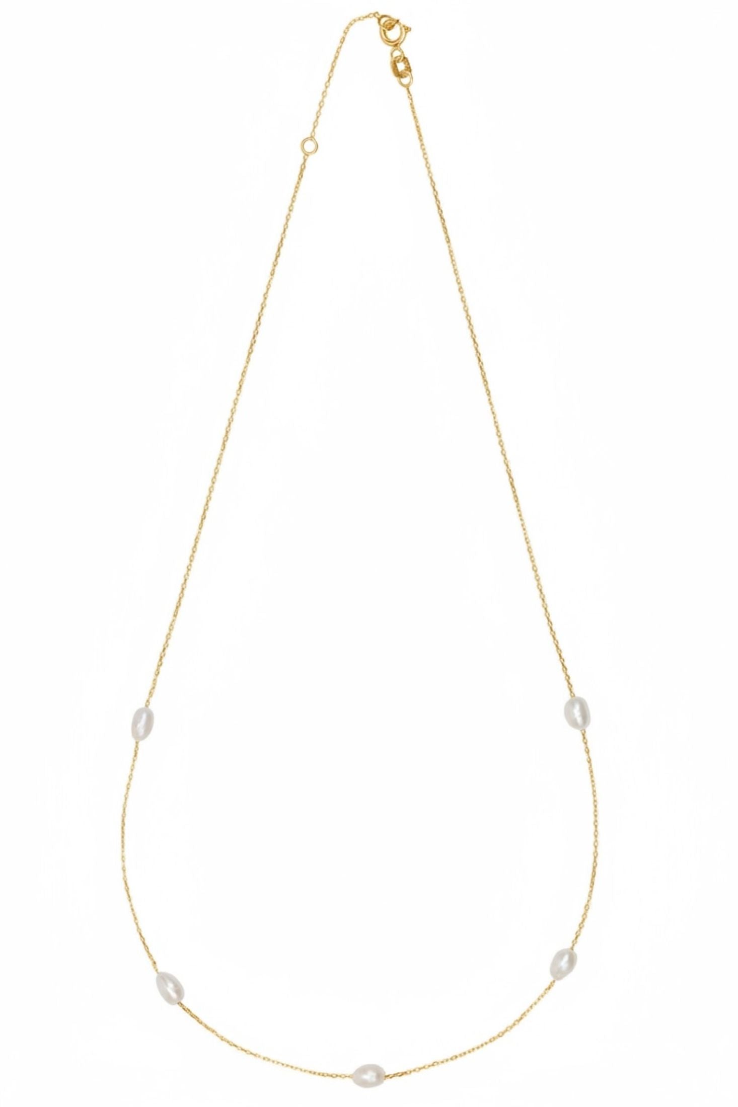 Gold necklace with pearls on a white background