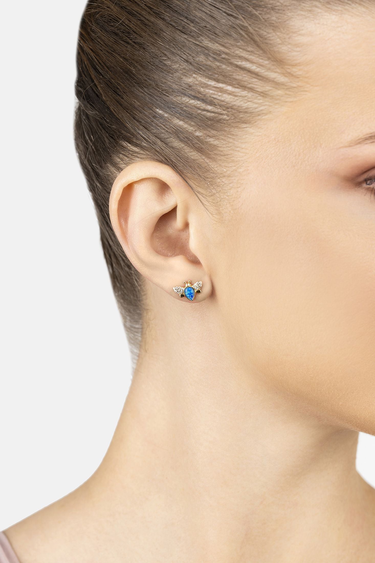 Angled view of Busy Bee Blue Opal Stud Earrings Gold, showing bee design, gold finish and the jewellery profile.