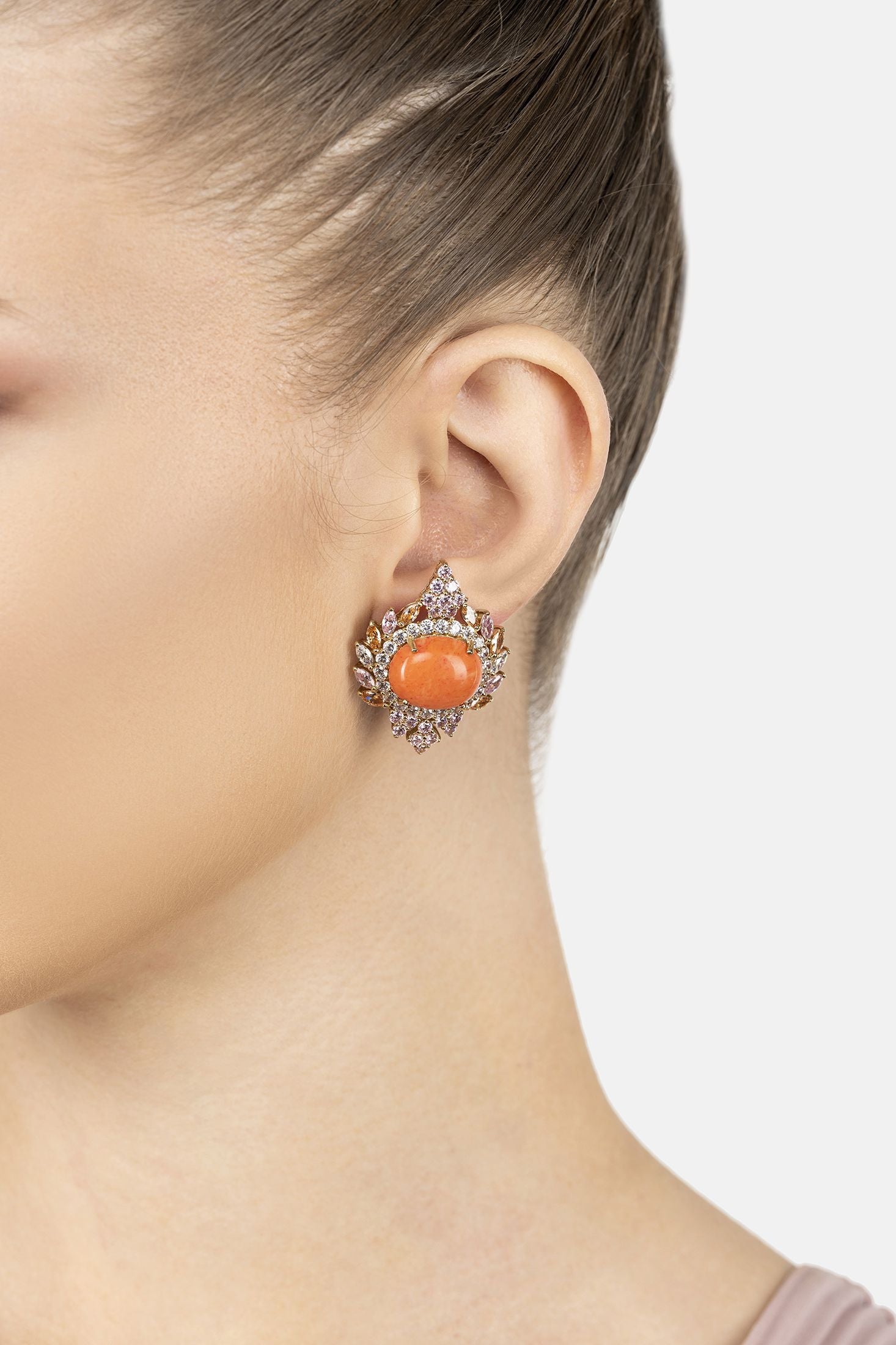 Angled view of Francesca Pink Coral Stud Earrings Gold, showing gold finish and the jewellery profile.