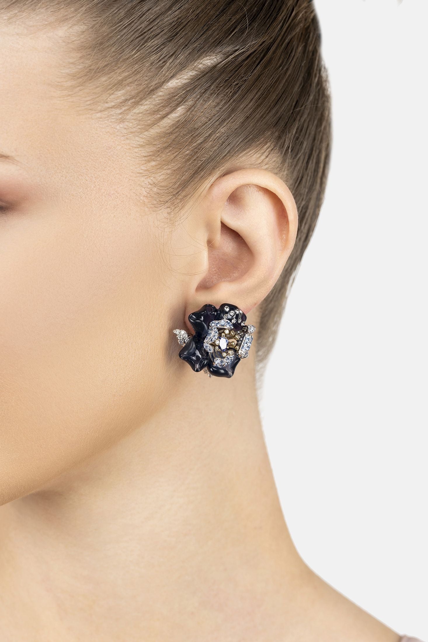 Angled view of Blue Rose Flower Stud Earrings Silver, showing flower design, silver finish and the jewellery profile.
