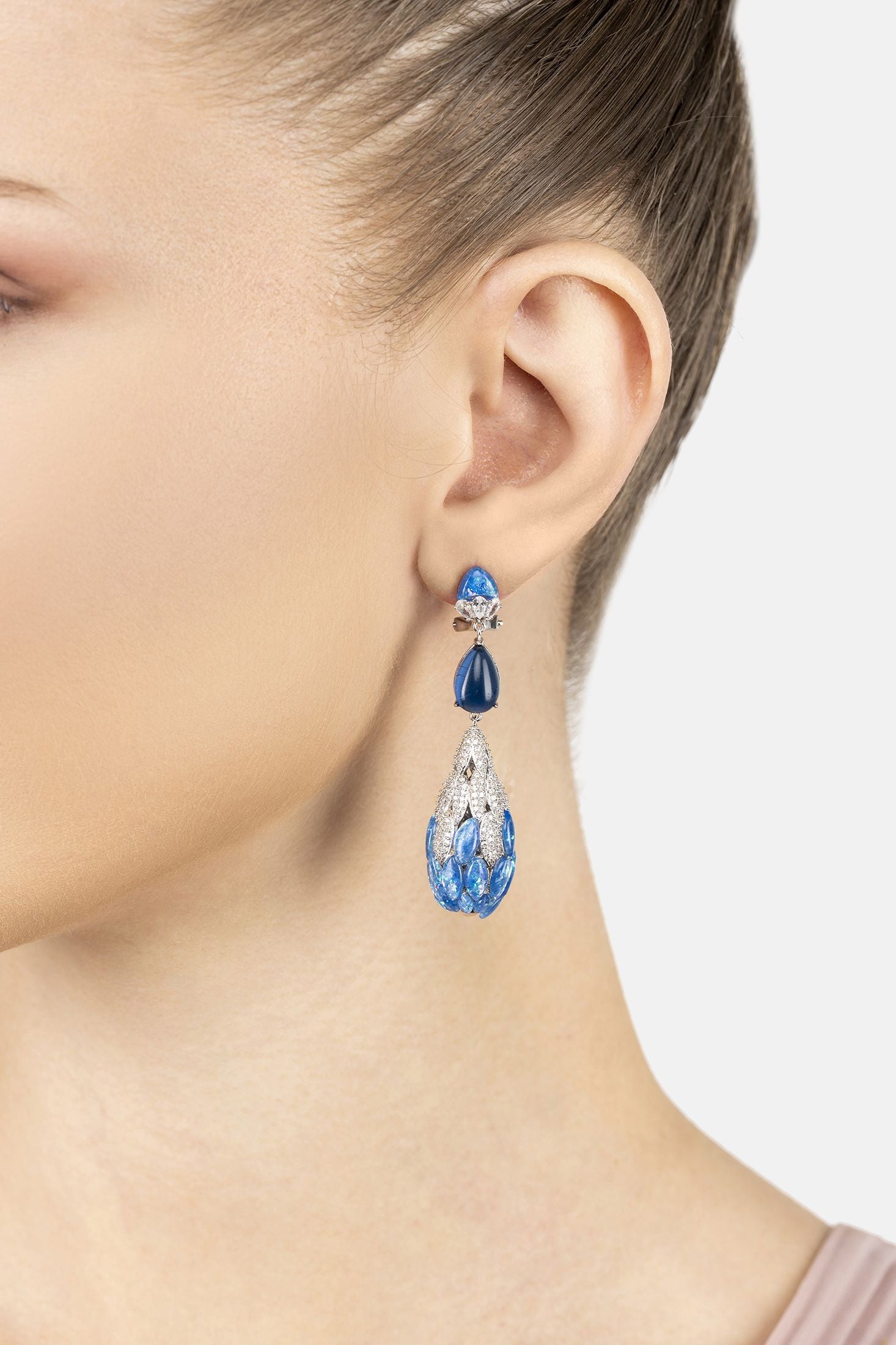 Angled view of Carmen Blue Opal Drop Earrings Silver, showing silver finish and the jewellery profile.