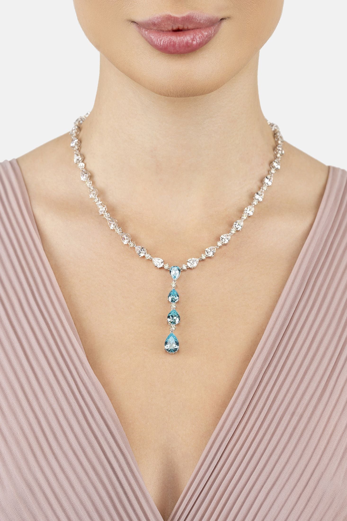 Angled view of Elizabeth Statement Necklace Blue Topaz Silver, showing blue topaz detailing, silver finish and the jewellery profile.