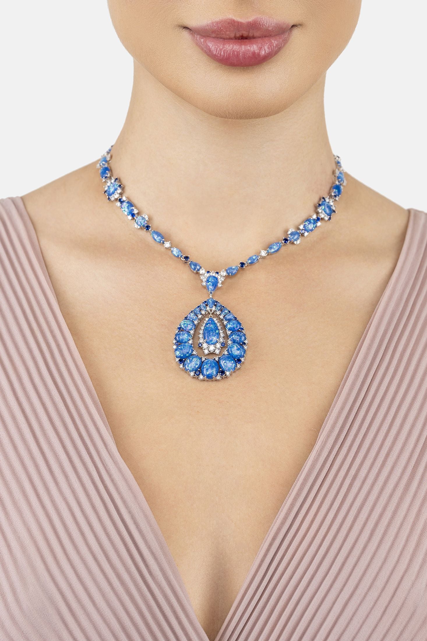 Angled view of Paloma Blue Opal Statement Necklace Silver, showing silver finish and the jewellery profile.