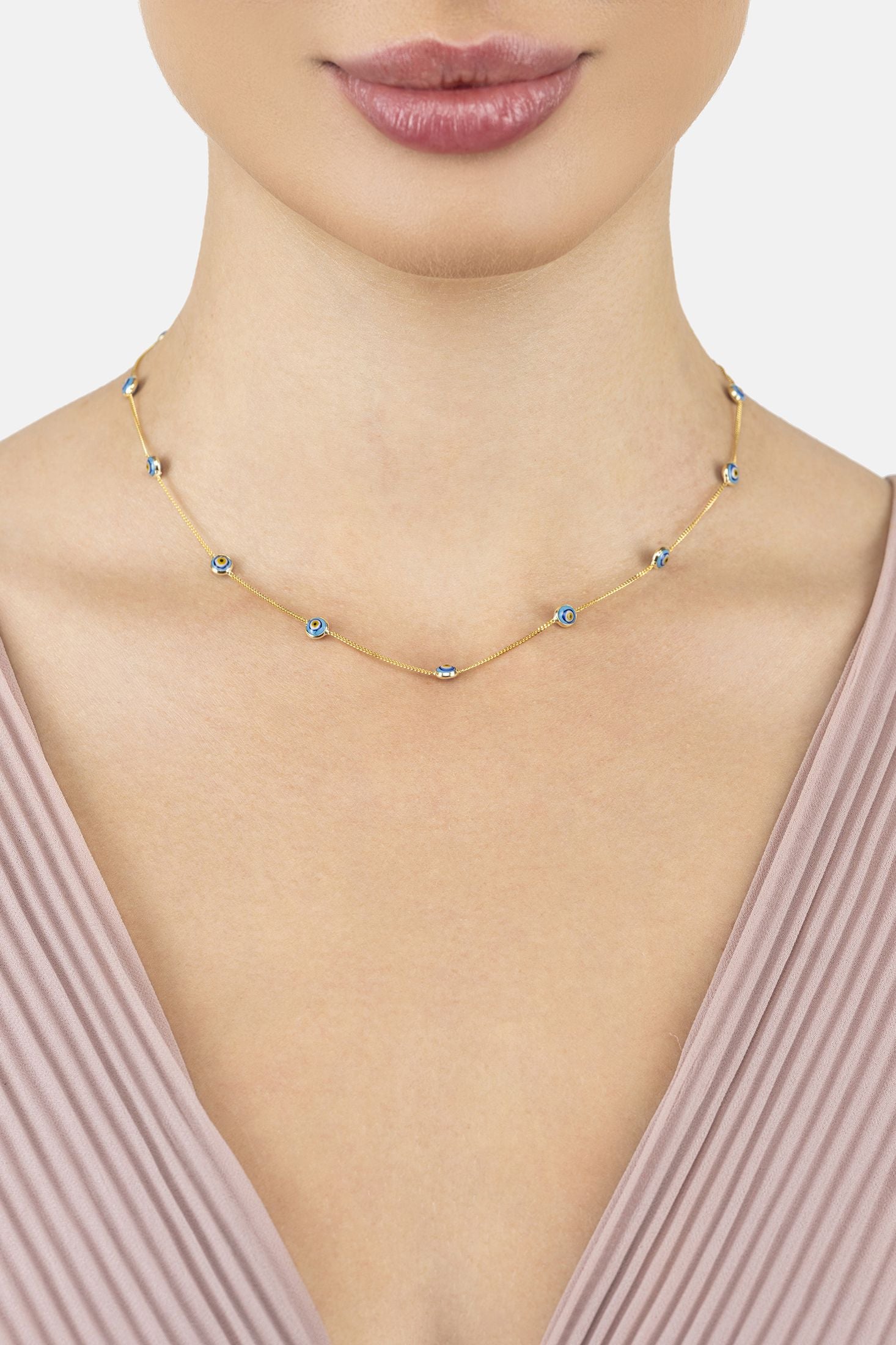 Angled view of Evil Eye Blue Enamel Choker Necklace Gold, showing evil eye design, gold finish and the jewellery profile.
