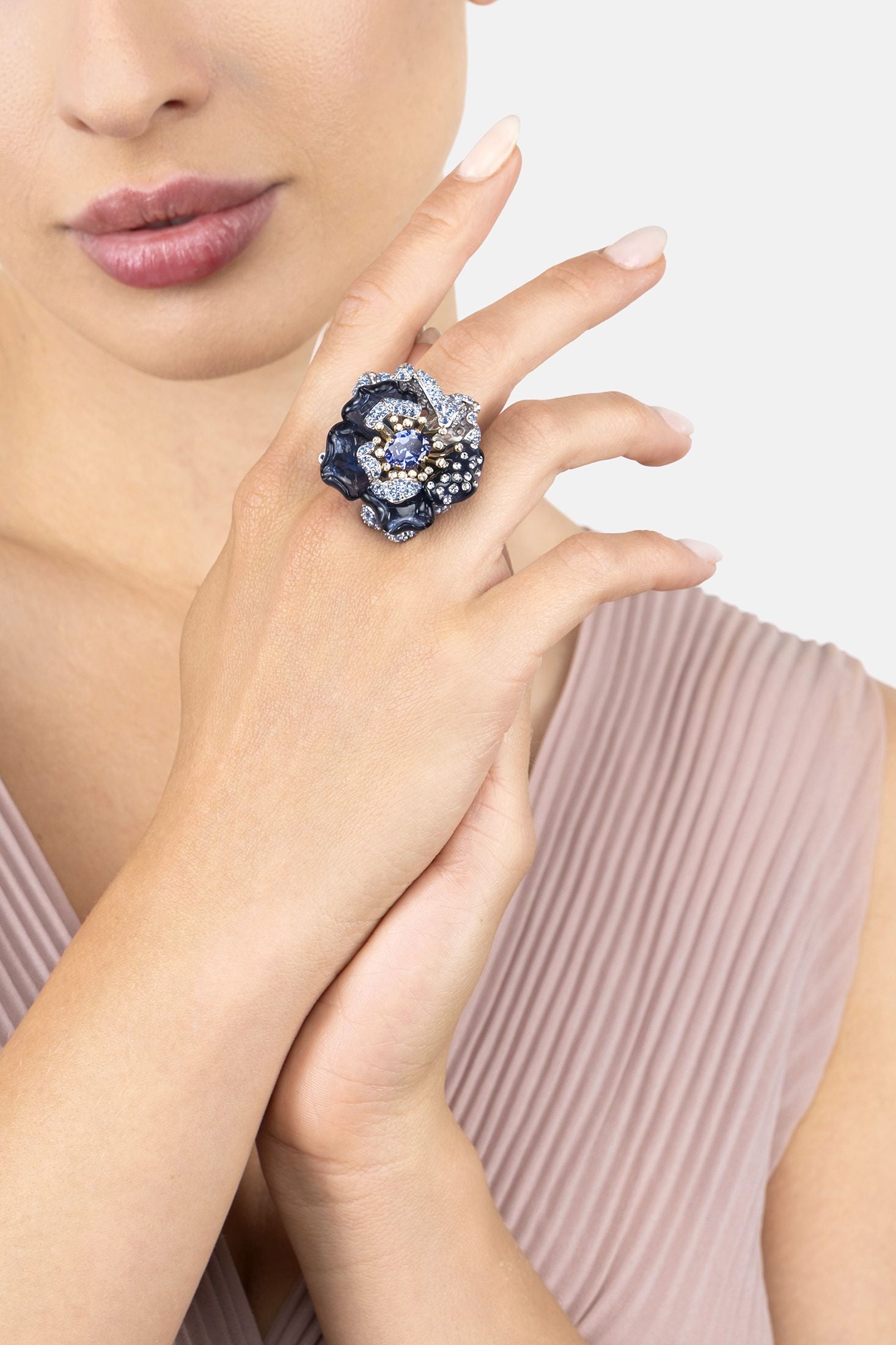 Angled view of Blue Rose Flower Cocktail Ring Silver, showing flower design, silver finish and the jewellery profile.