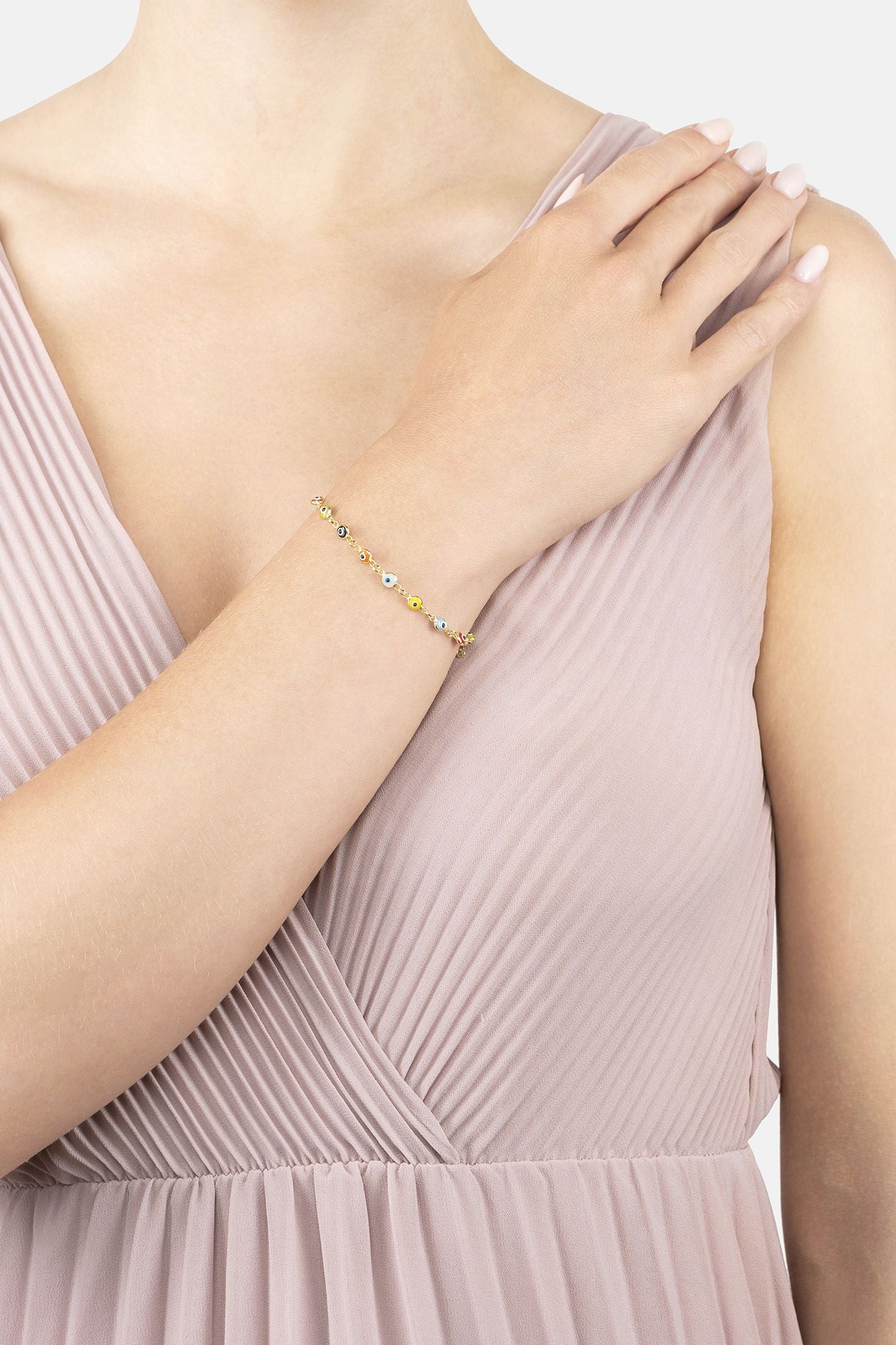 Angled view of Evil Eye Multicoloured Enamel Bracelet Gold, showing evil eye design, gold finish and the jewellery profile.